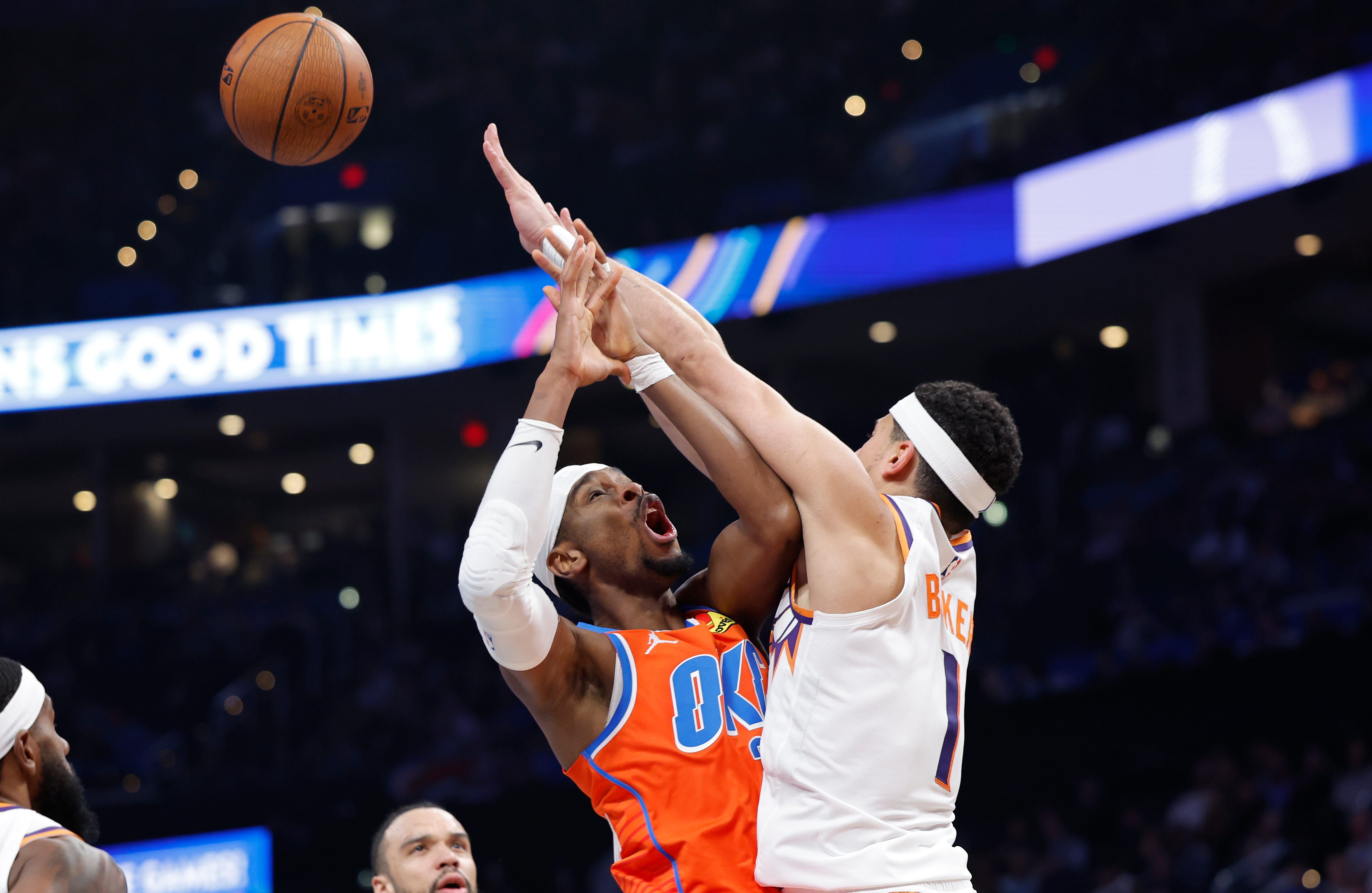 Nov 28, 2025; Oklahoma City, Oklahoma, USA; Phoenix Suns guard Devin Booker (1) fouls Oklahoma City Thunder guard Shai Gilgeous-Alexander (2) during the second half at Paycom Center. Mandatory Credit: Alonzo Adams-Imagn Images