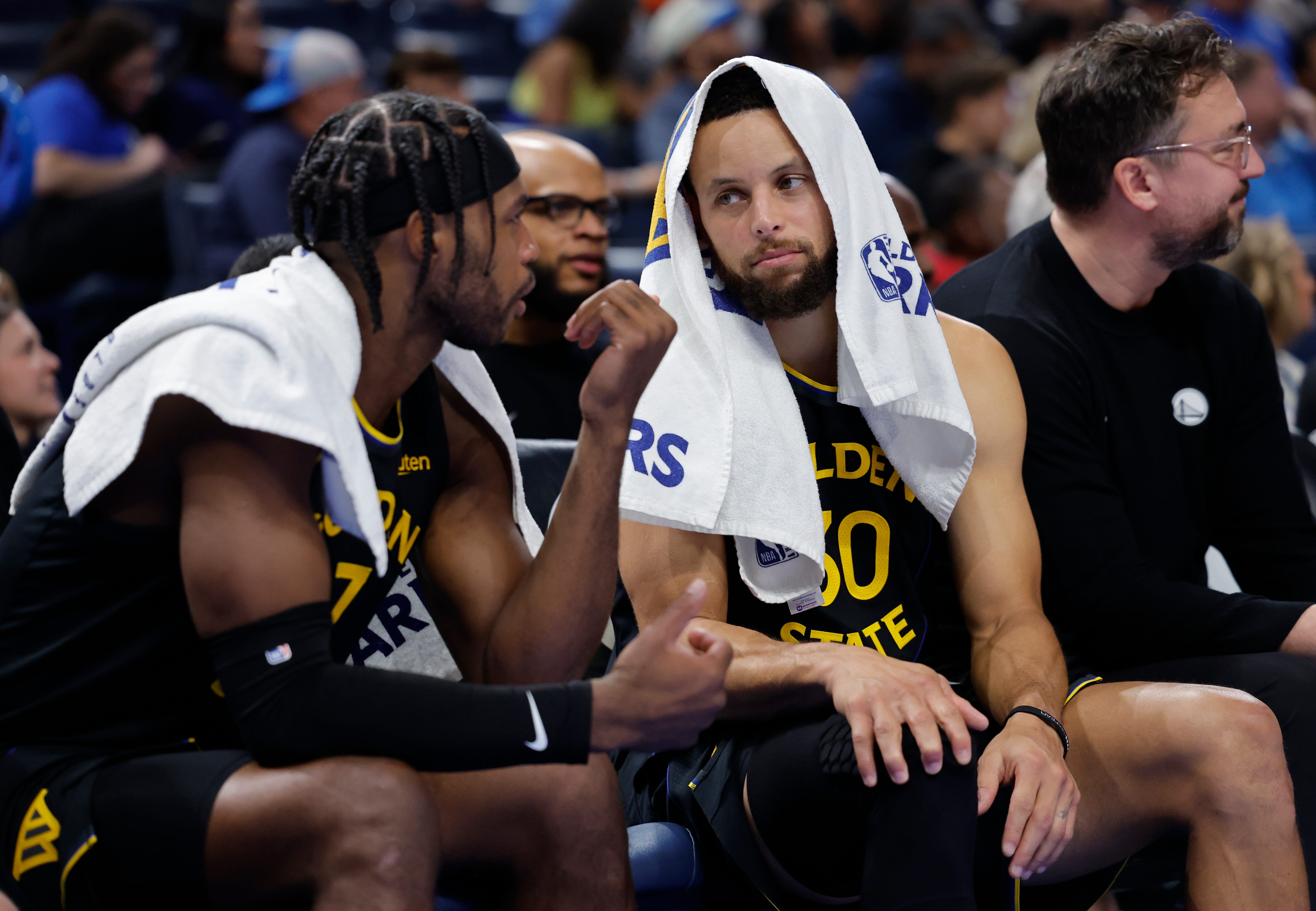 Nov 11, 2025; Oklahoma City, Oklahoma, USA; Golden State Warriors guard Buddy Hield (7) and guard Stephen Curry (30) talk on the bench during the second half against the Oklahoma City Thunder at Paycom Center. Mandatory Credit: Alonzo Adams-Imagn Images