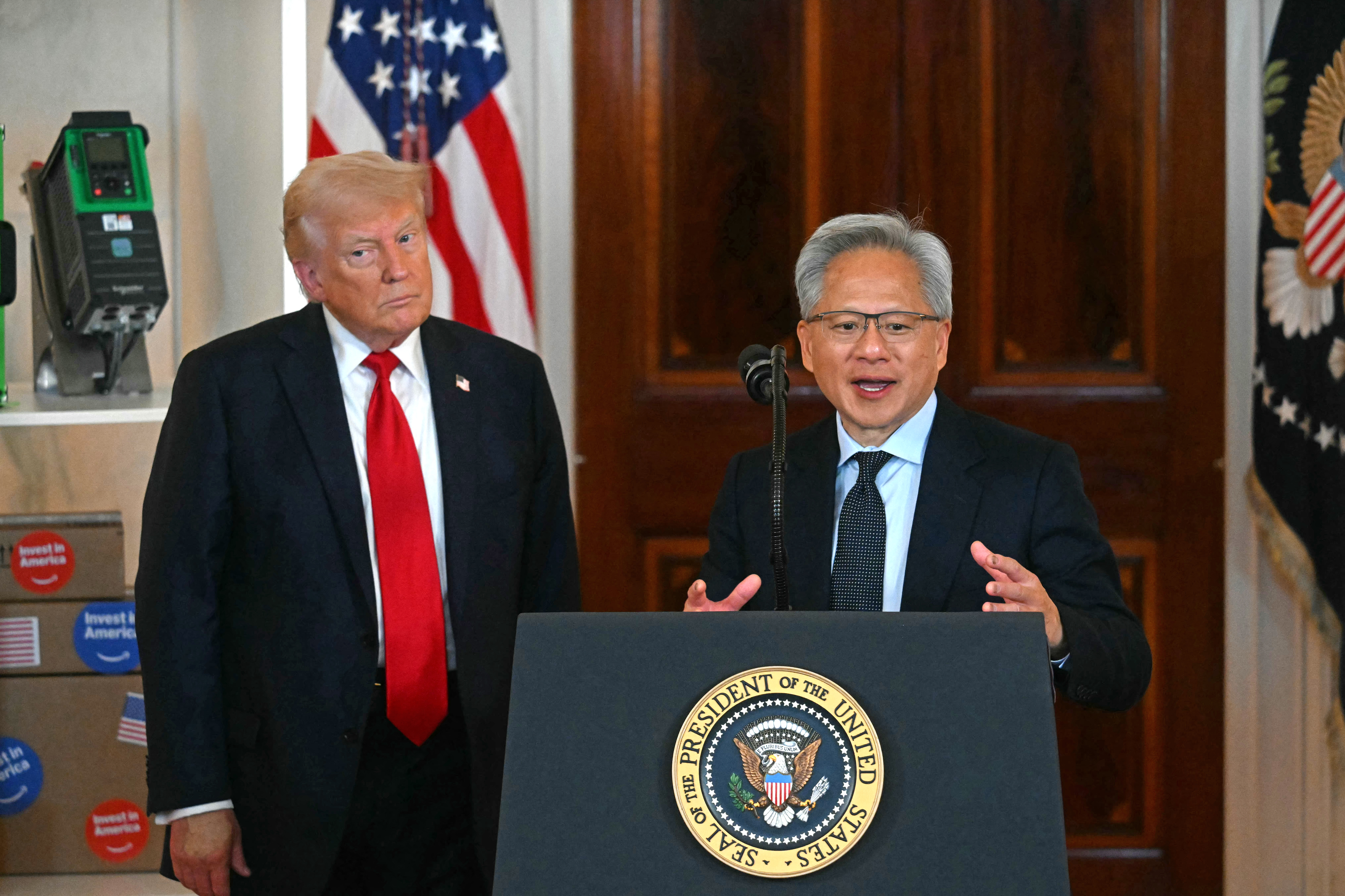 (FILES) Nvidia CEO Jensen Huang (R) speaks alongside US President Donald Trump about investing in America, at the White House in Washington, DC, on April 30, 2025.