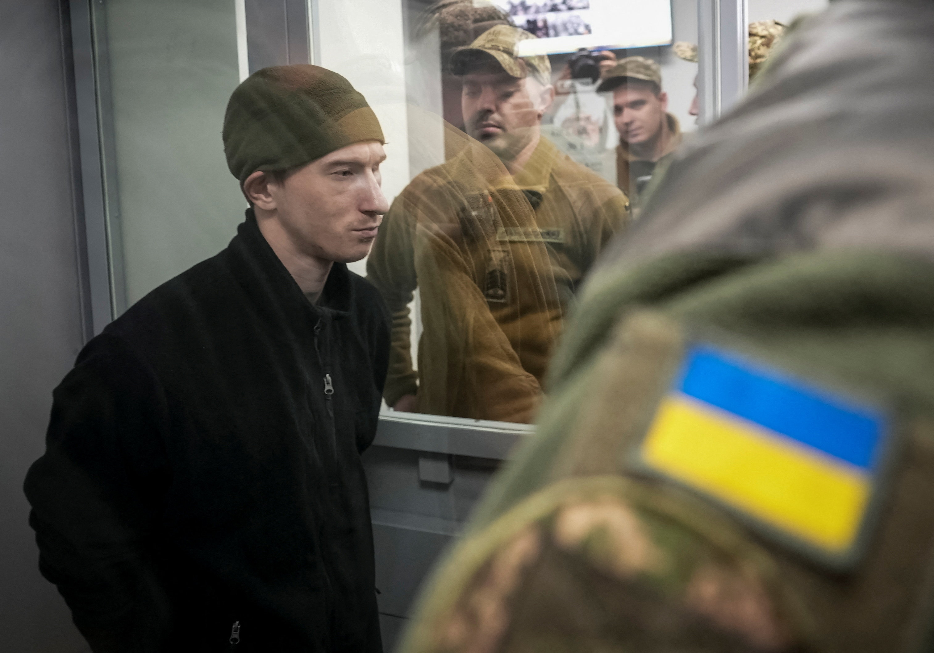 Russian soldier Dmytro Kurashov, accused of committing a war crime by executing a Ukrainian serviceman who had surrendered during combat, attends a court hearing expected to deliver a verdict, amid Russia's invasion of Ukraine, in Zaporizhzhia, Ukraine November 6, 2025. REUTERS/Inna Varenytsia