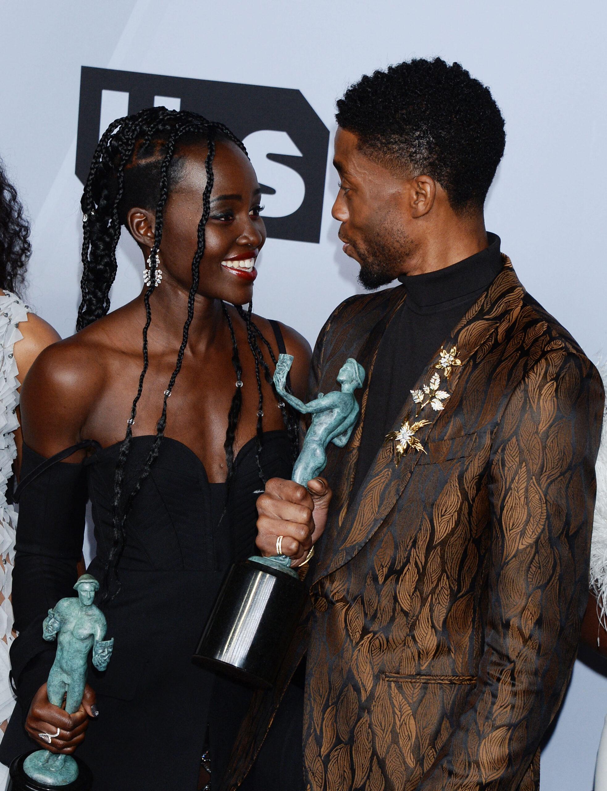 Lupita Nyong&rsquo;o and Chadwick Boseman smiling
