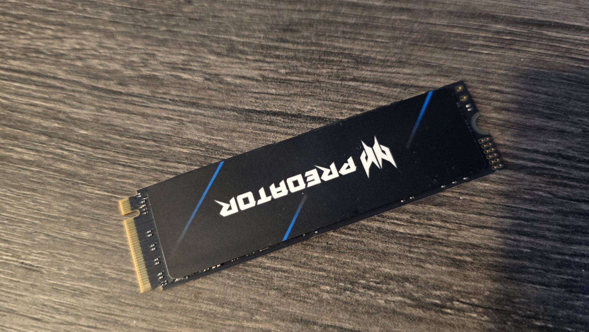 An Acer SSD on a desk and ready to be installed in a gaming PC.