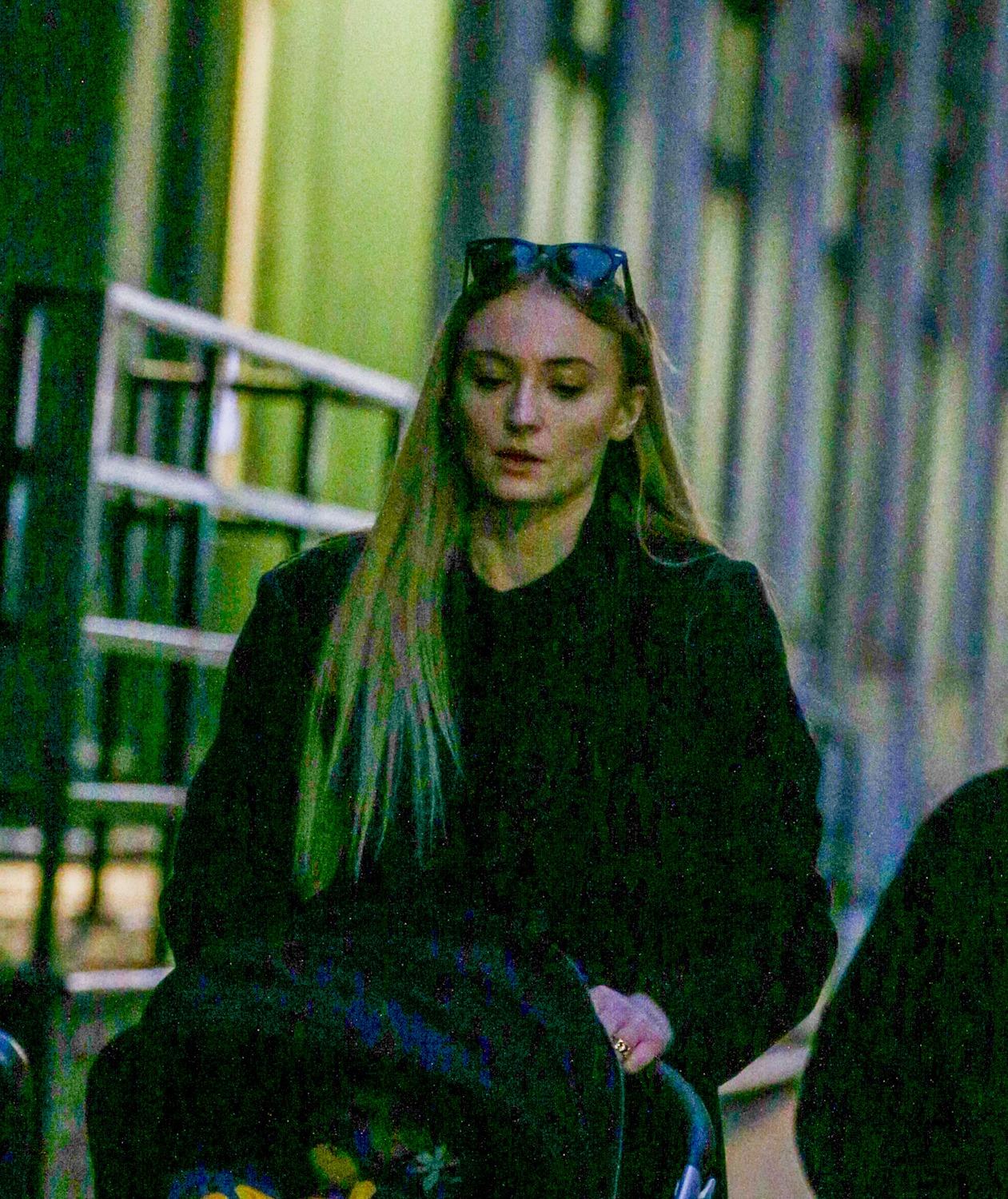 Sophie Turner takes a stroll with her two young daughters in NYC.