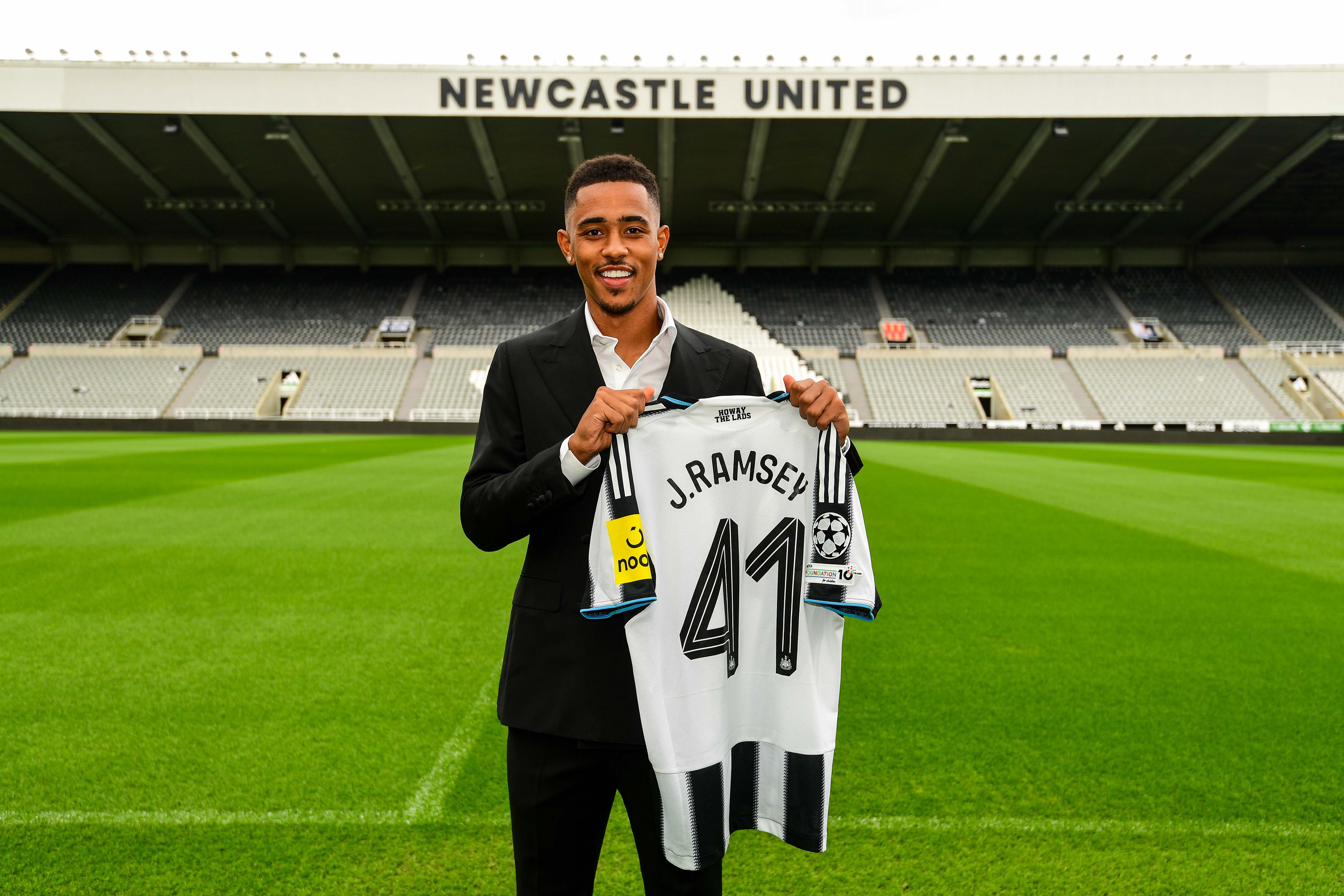 NEWCASTLE UPON TYNE, ENGLAND - AUGUST 17: In this image released on August 17, 2025, Jacob Ramsey poses for photographs after signing for Newcastle United at St. James Park in Newcastle upon Tyne, England. (Photo by Harriet Massey/ Newcastle United via Getty Images)