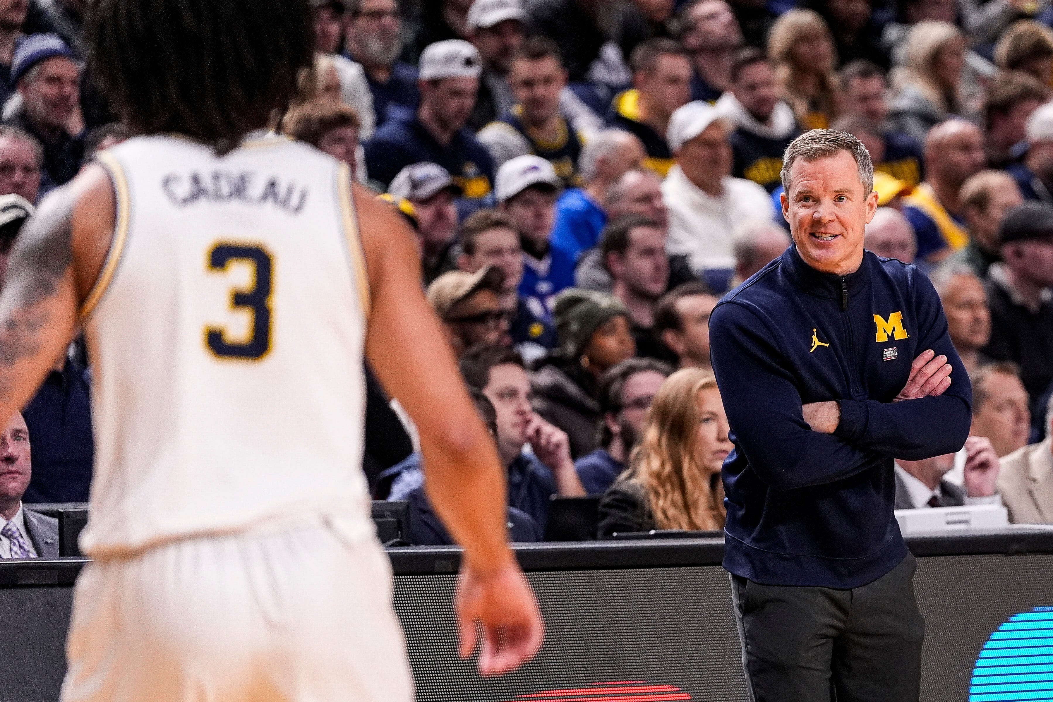 Michigan head coach Dusty May talks to guard Elliot Cadeau (3) before a play against Saint Louis during the first half of NCAA Tournament Second Round at KeyBank Center in Buffalo on Saturday, March 21, 2026.