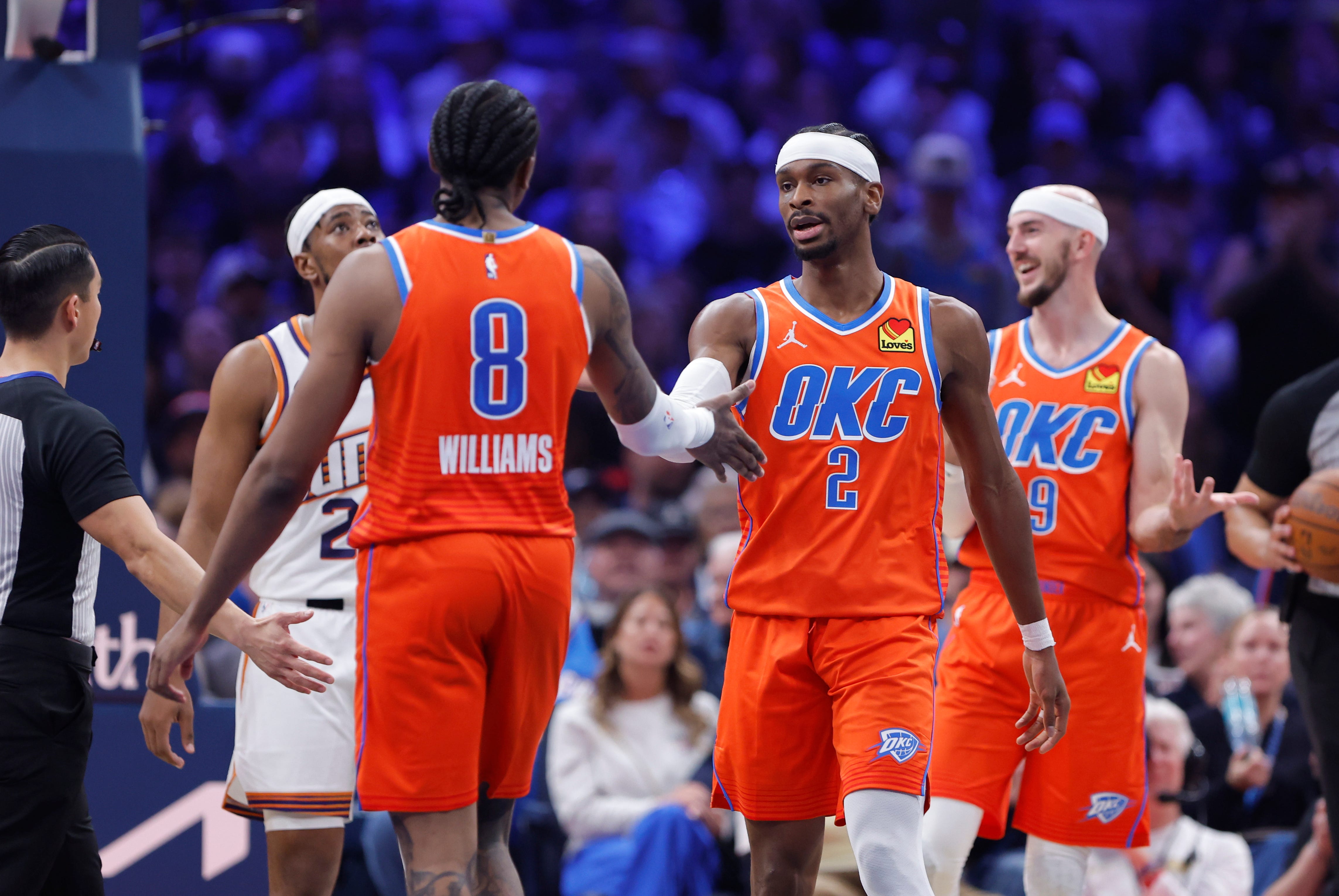 Nov 28, 2025; Oklahoma City, Oklahoma, USA; Oklahoma City Thunder guard Shai Gilgeous-Alexander (2) and guard Jalen Williams (8) high five after a play against the Phoenix Suns during the second quarter at Paycom Center. Mandatory Credit: Alonzo Adams-Imagn Images