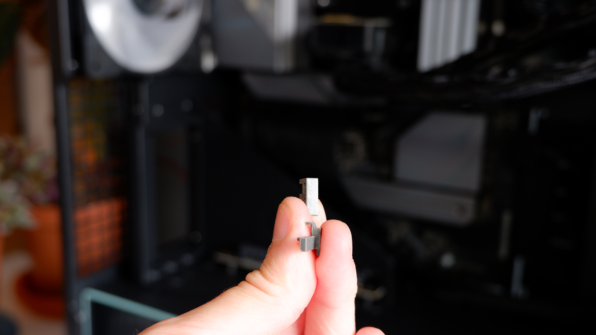 Arctic's Xtender PC case on a white desk with various parts being installed to build a functional gaming PC.