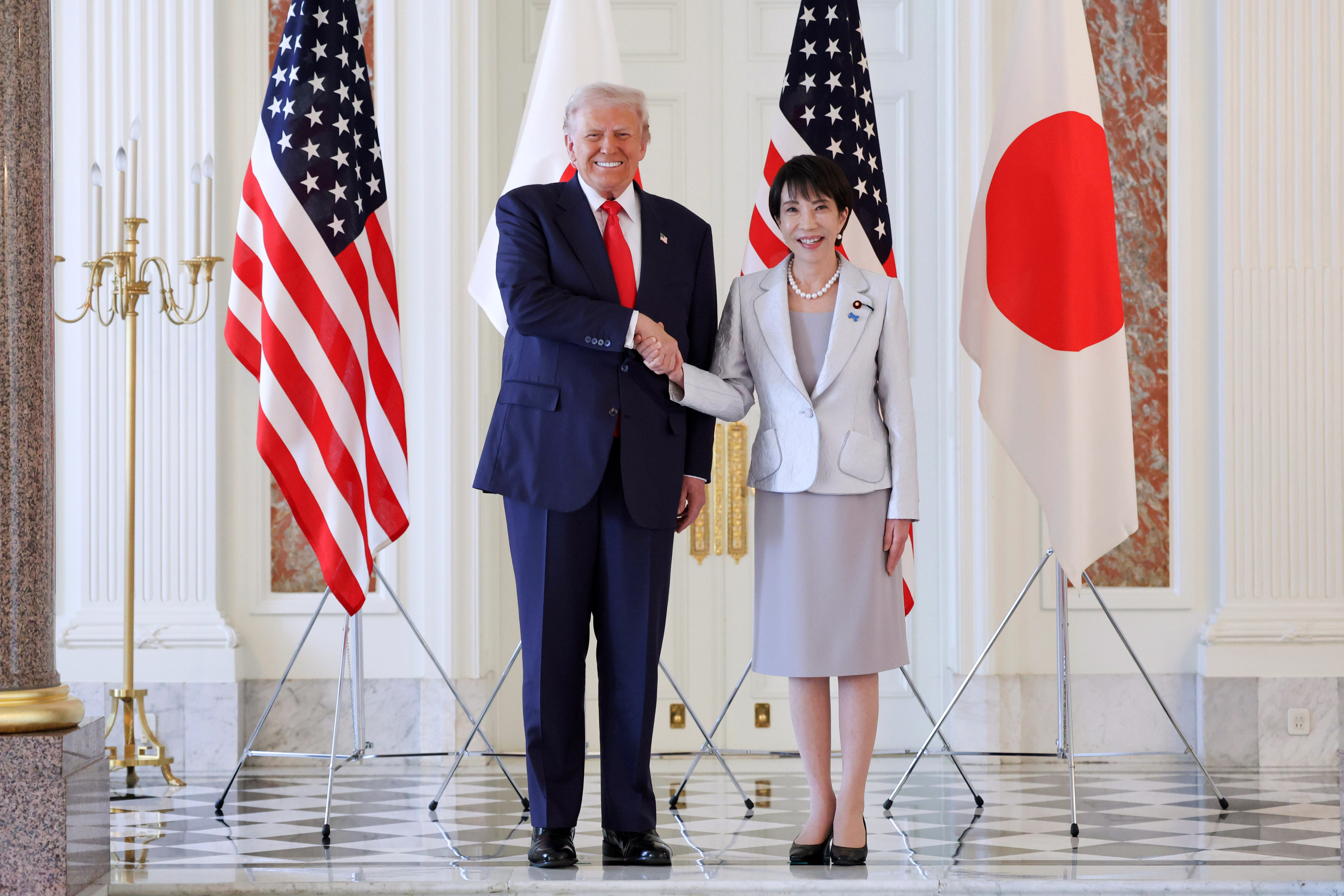 epa12487124 US President Donald Trump (L) shakes hands with Japan's Prime Minister Sanae Takaichi upon his arrival at Akasaka Palace State Guest House for the Japan-US summit meeting in Tokyo, Japan, 28 October 2025. Trump is on a three-day visit to Japan from 27 to 29 October to reaffirm the Japan&ndash;U.S. alliance and advance economic talks. EPA/JAPAN POOL / JIJI PRESS EDITORIAL USE ONLY/JAPAN OUT