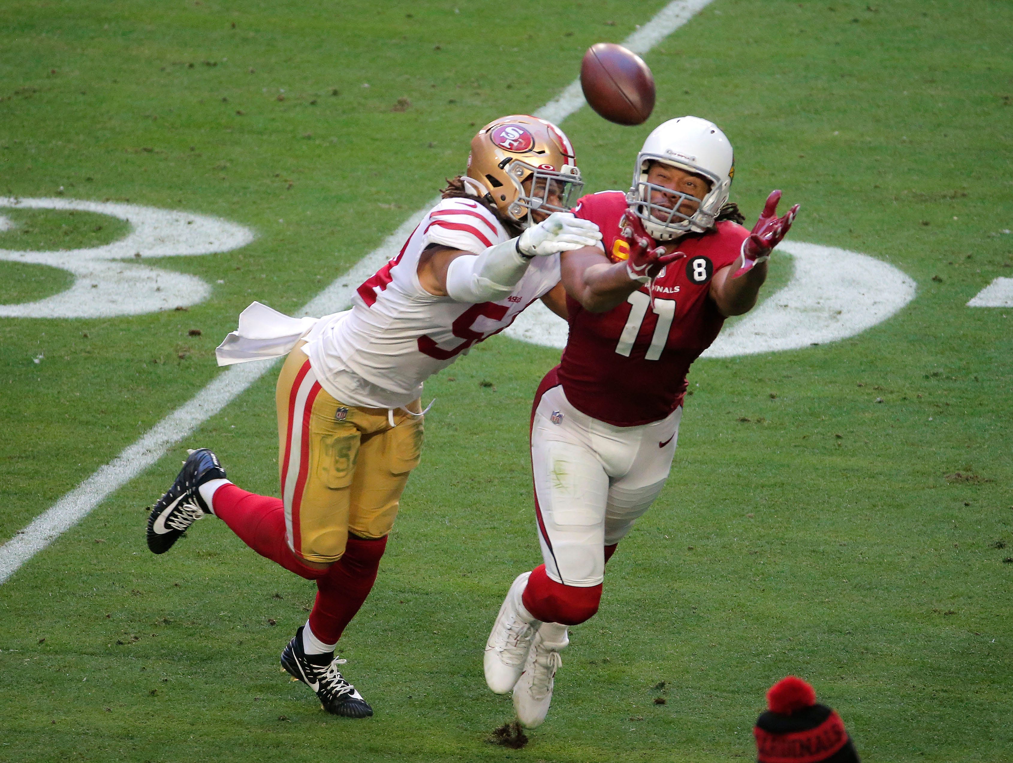 San Francisco 49ers linebacker Fred Warner keeps Arizona Cardinals wide receiver Larry Fitzgerald from making a catch. Nfl San Francisco 49ers At Arizona Cardinals