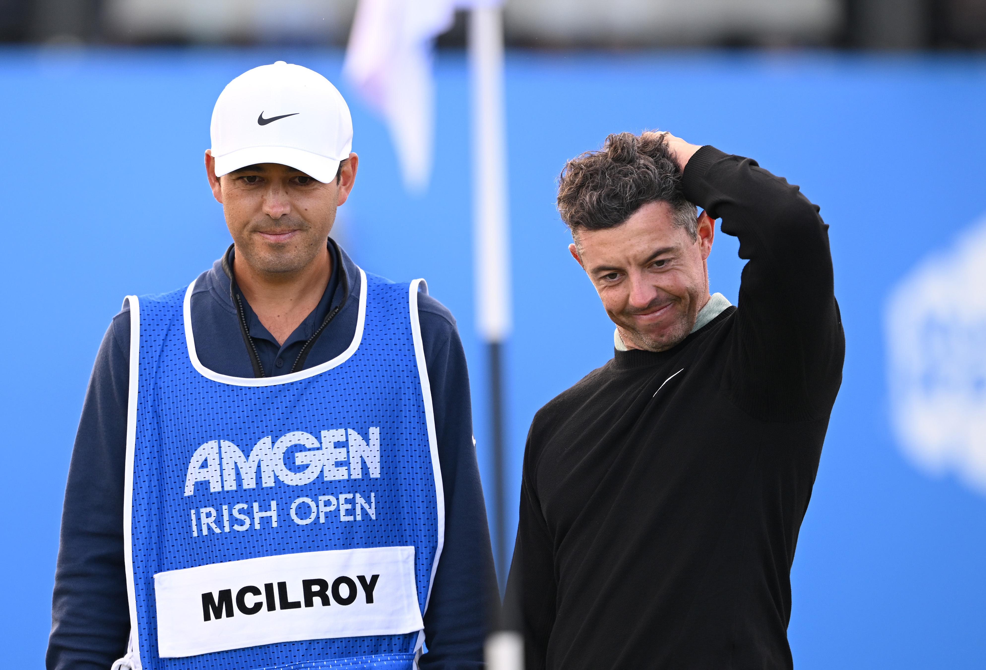 NEWCASTLE, NORTHERN IRELAND - SEPTEMBER 15: Rory McIlroy of Northern Ireland and his caddie Harry Diamond react on the 18th green during day four of the Amgen Irish Open 2024 at Royal County Down Golf Club on September 15, 2024 in Newcastle, Northern Ireland. (Photo by Ross Kinnaird/Getty Images)