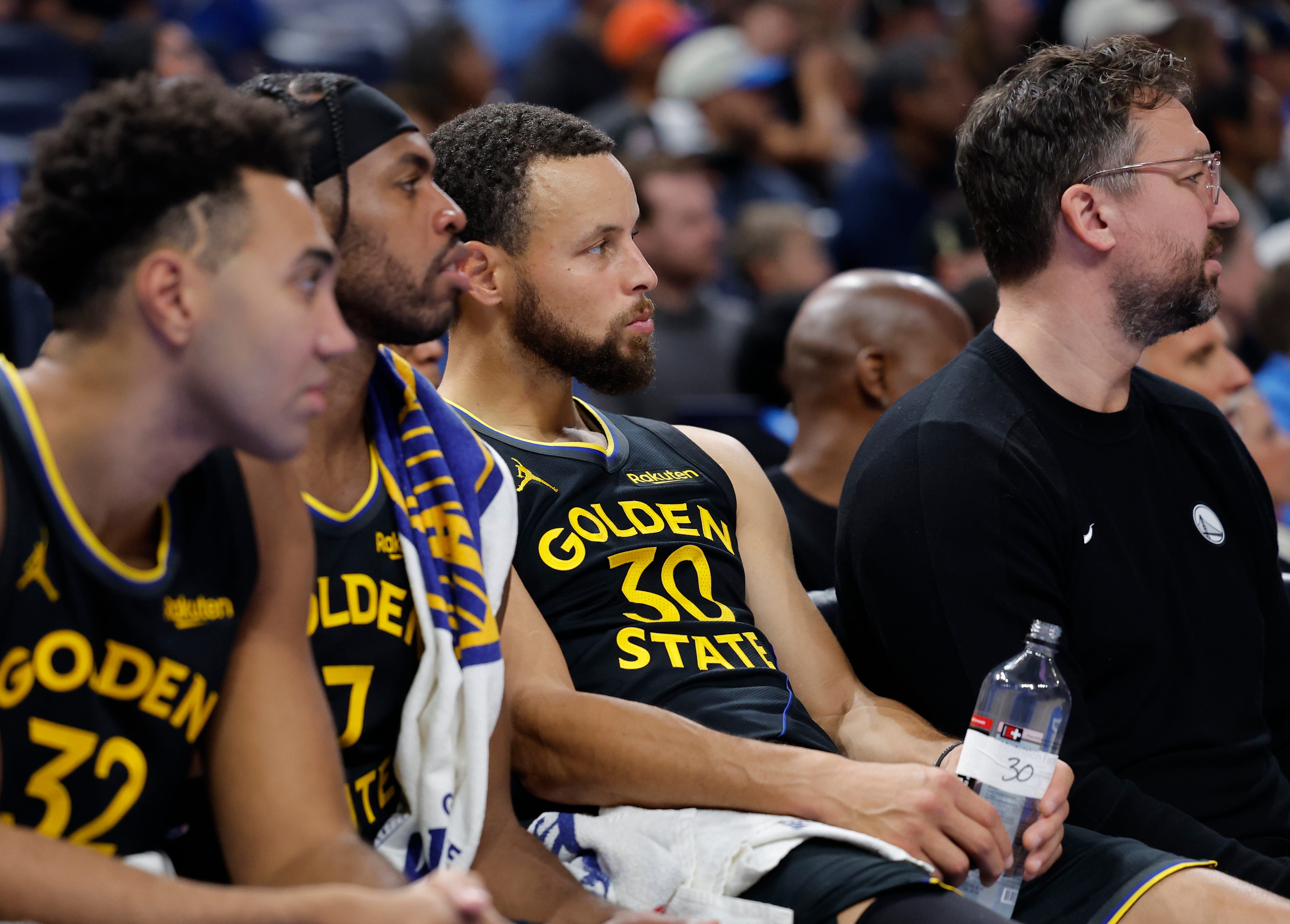 Nov 11, 2025; Oklahoma City, Oklahoma, USA; Golden State Warriors guard Stephen Curry (30) watches his team play against the Oklahoma City Thunder during the fourth quarter at Paycom Center. Mandatory Credit: Alonzo Adams-Imagn Images