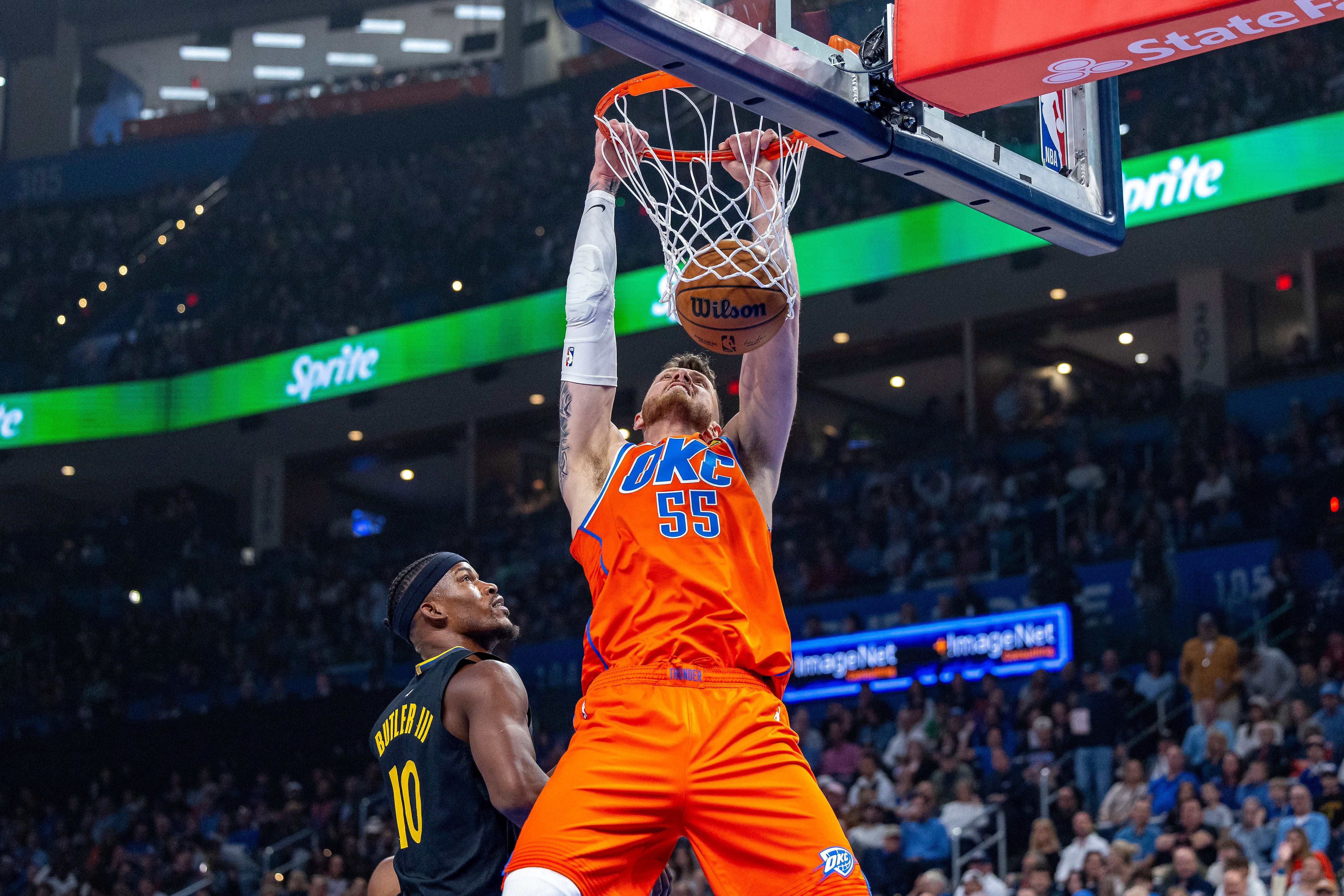 Nov 11, 2025; Oklahoma City, Oklahoma, USA; Oklahoma City Thunder center Isaiah Hartenstein (55) dunks against the Golden State Warriors during the first quarter at Paycom Center. Mandatory Credit: Alonzo Adams-Imagn Images