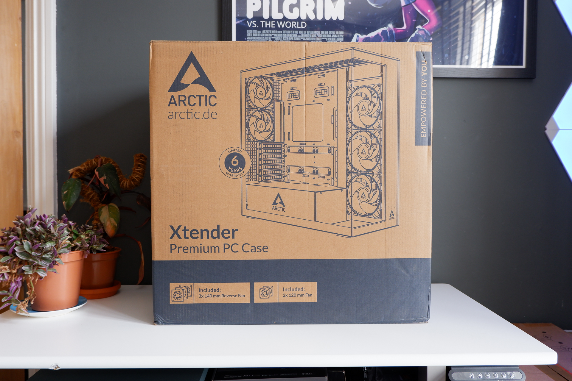 Arctic's Xtender PC case on a white desk with various parts being installed to build a functional gaming PC.