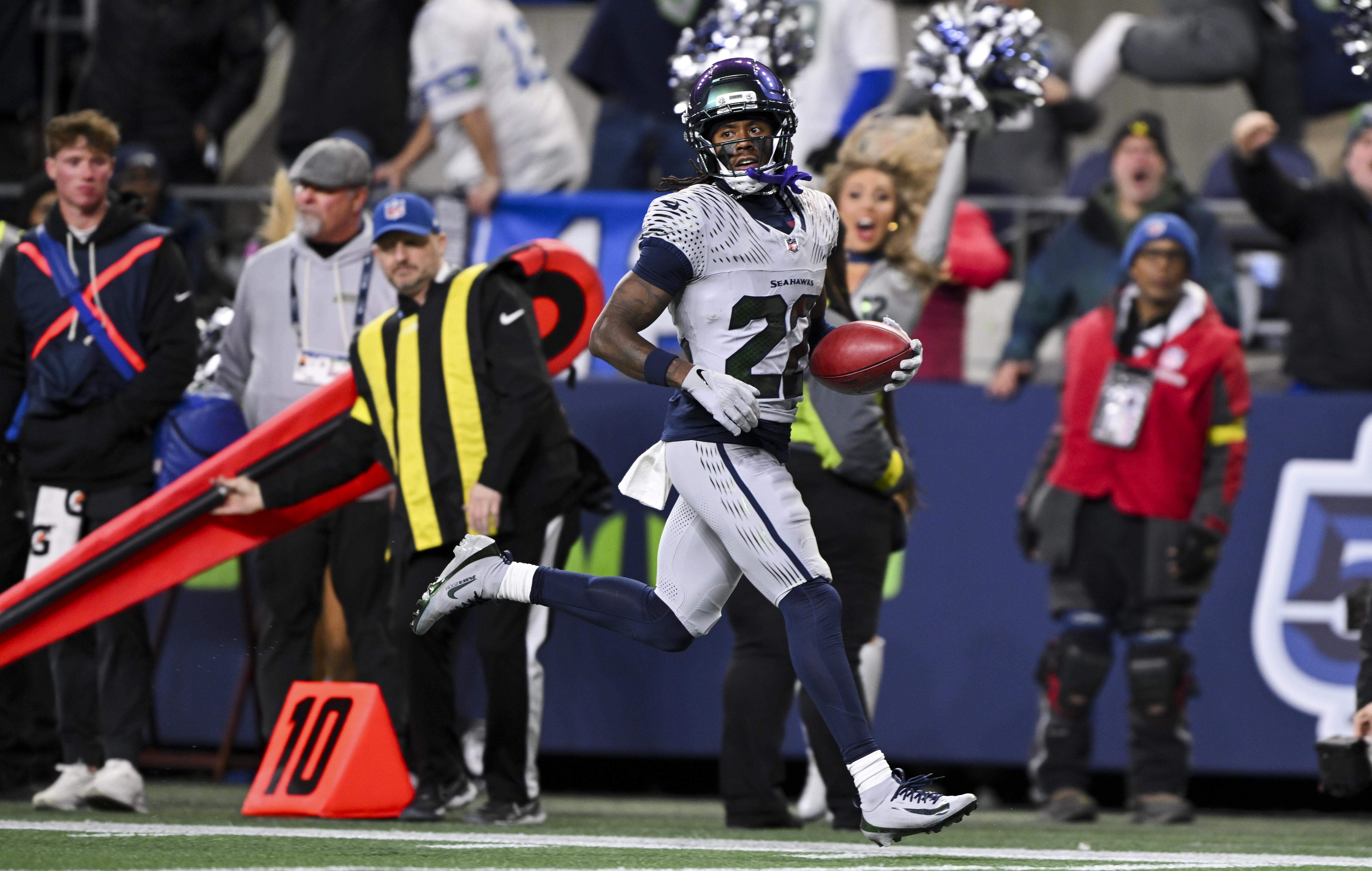 Seattle Seahawks wide receiver Rashid Shaheed (22) returns a punt for a 58-yard touchdown during the fourth quarter of the game at Lumen Field, on Thursday, Dec. 18, 2025, in Seattle.