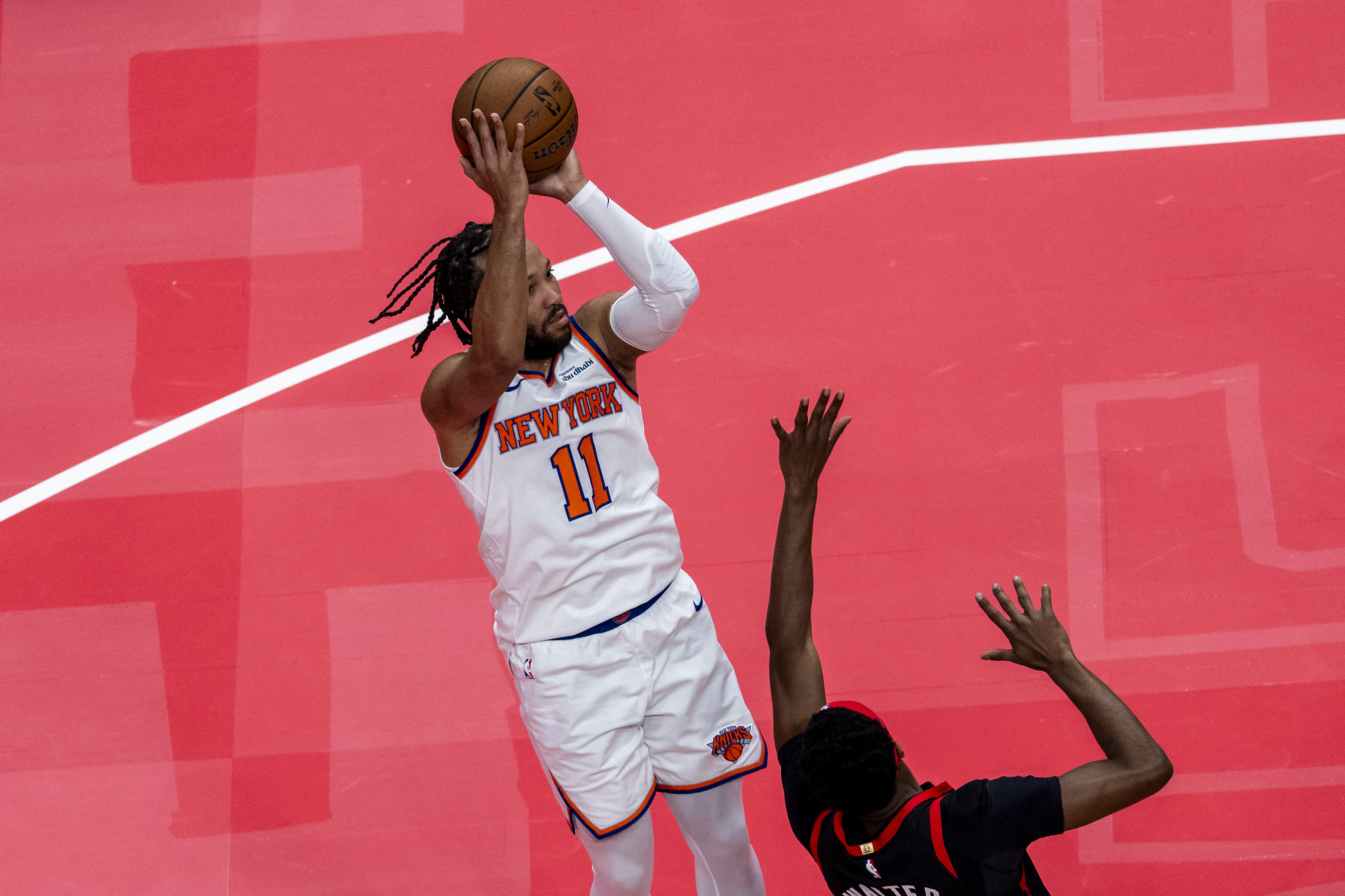 New York Knicks guard Jalen Brunson (11) shoots against the Toronto Raptors during the first half at the 2025-26 NBA Emirates Cup at Scotiabank Arena. Mandatory Credit: Kevin Sousa-Imagn Images