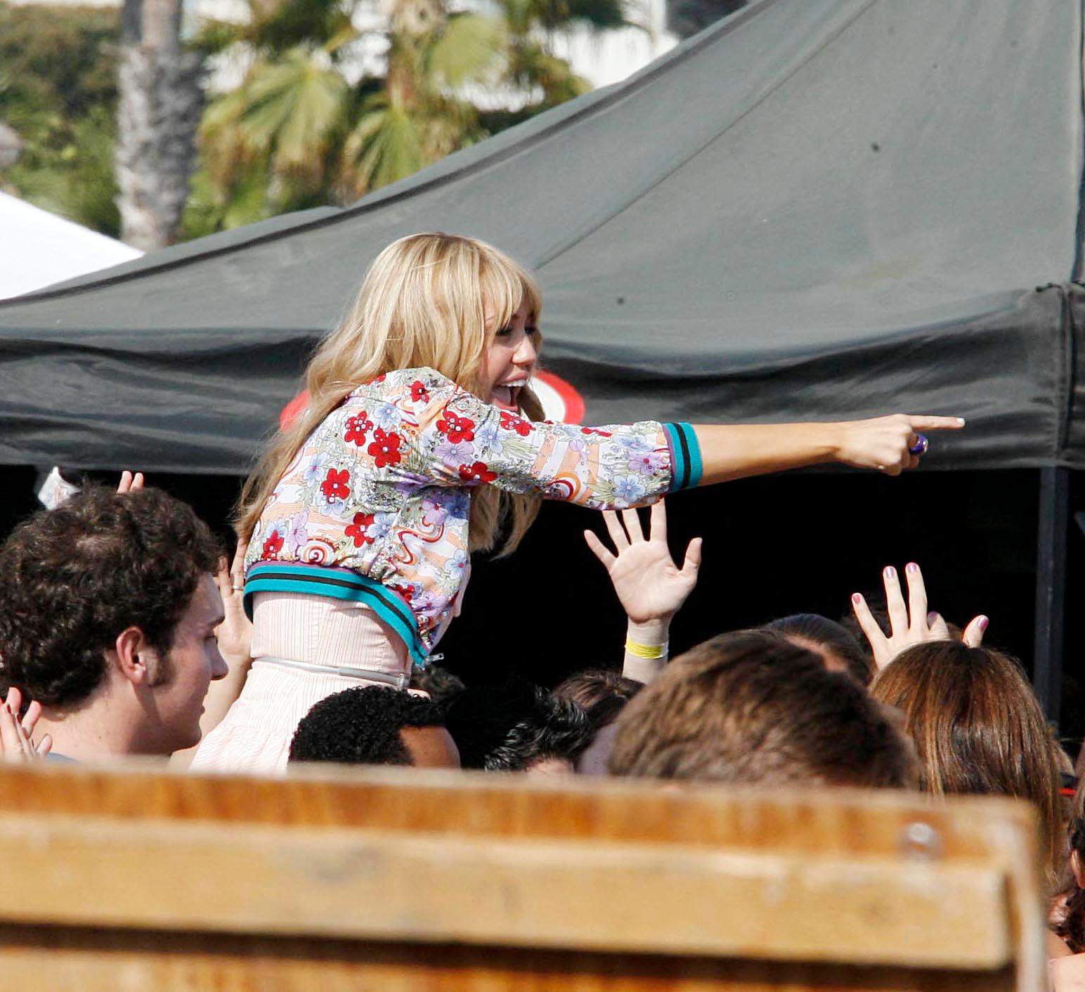 Miley Cyrus as Hannah Montana