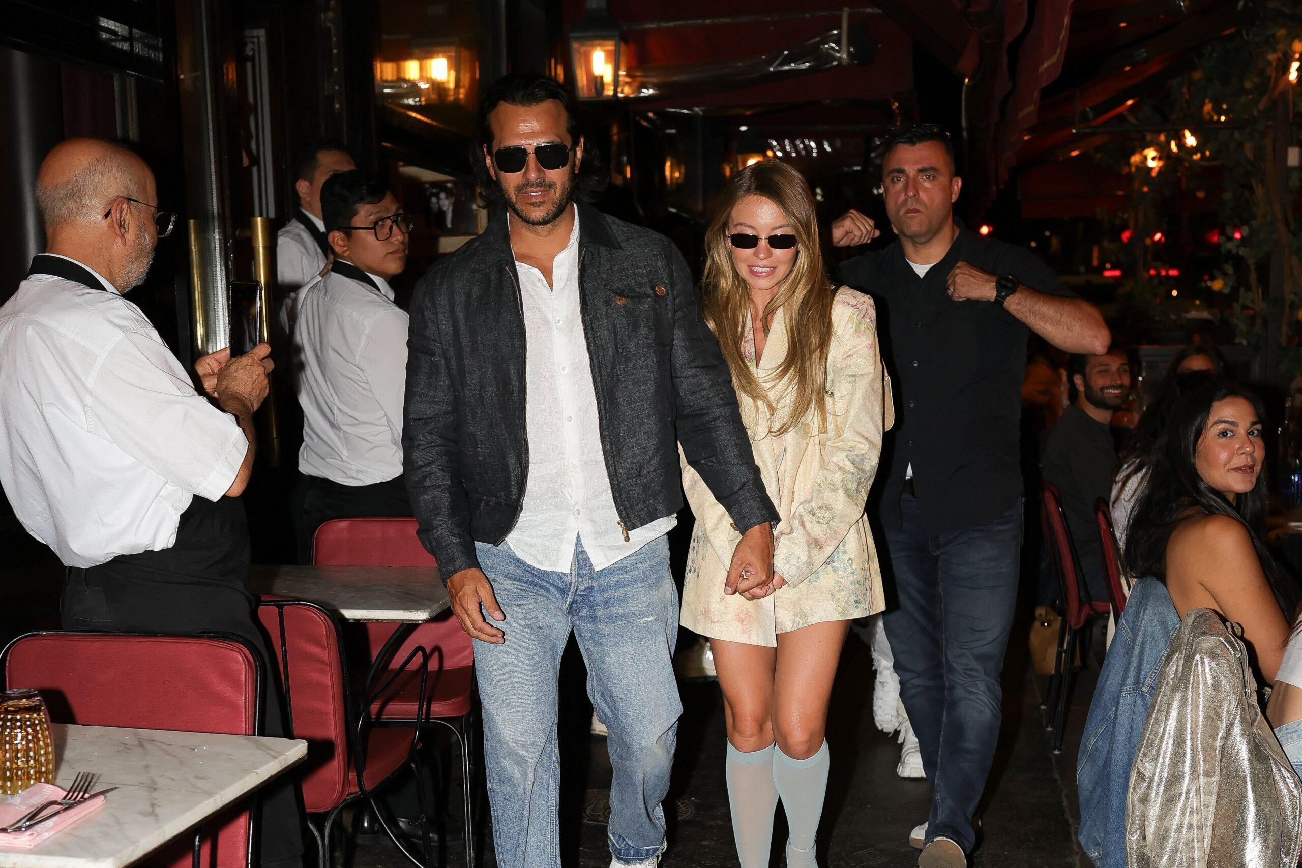 Sydney Sweeney and Jonathan Davino hand in hand after a romantic dinner in an Italian restaurant in Paris