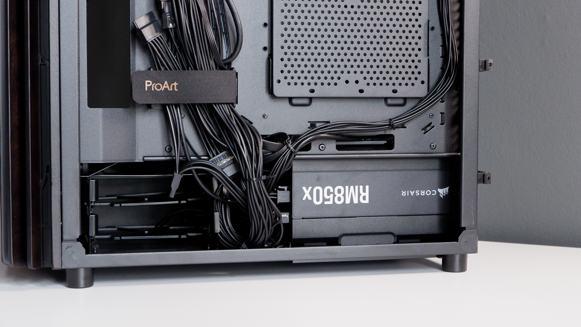 A gaming PC in the process of being built, using Radeon and Ryzen components and an Asus Pro Art PA401 PC case.