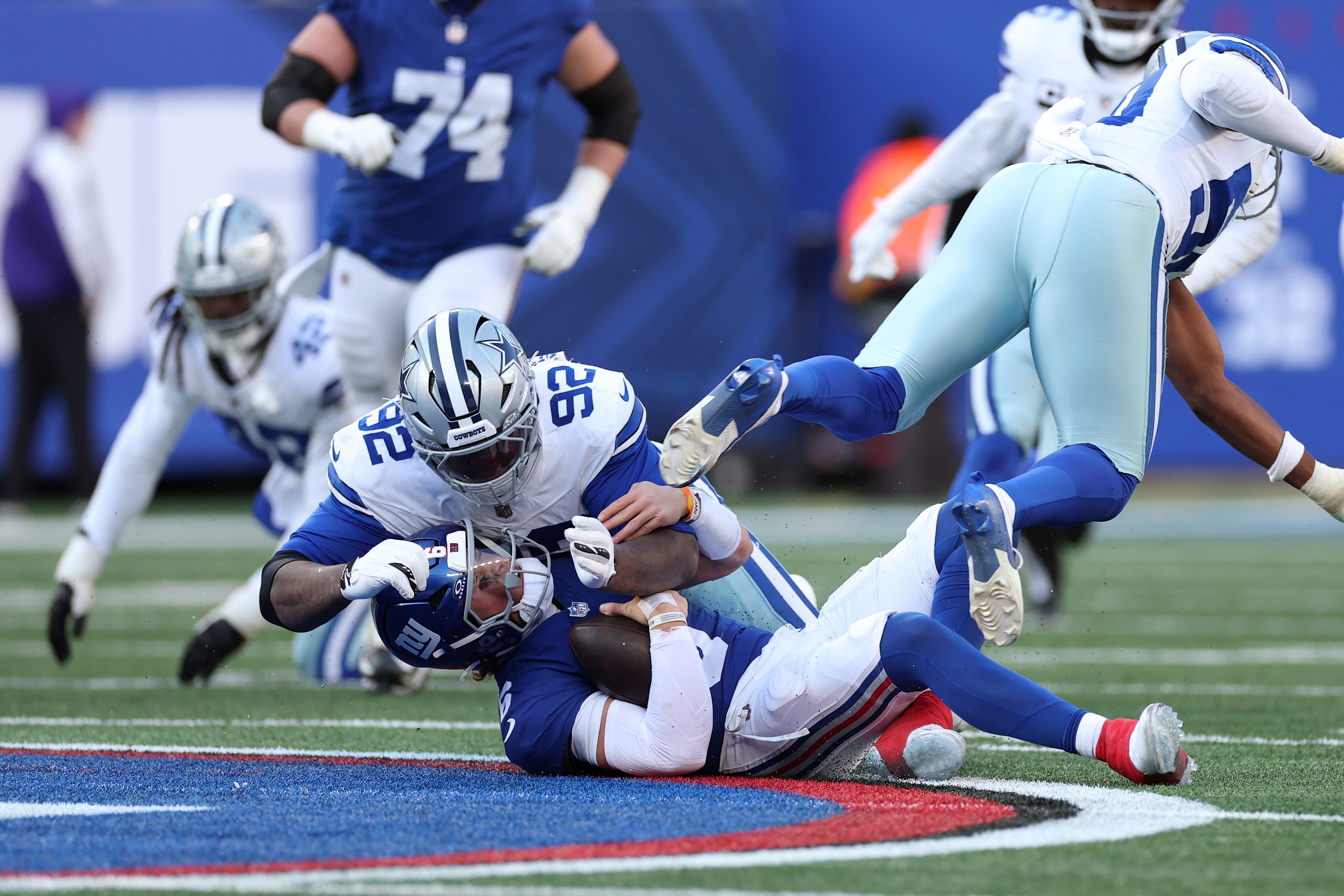 EAST RUTHERFORD, NEW JERSEY - JANUARY 04: Quinnen Williams #92 of the Dallas Cowboys hits Jaxson Dart #6 of the New York Giants during the third quarter at MetLife Stadium on January 04, 2026 in East Rutherford, New Jersey. (Photo by Al Bello/Getty Images)