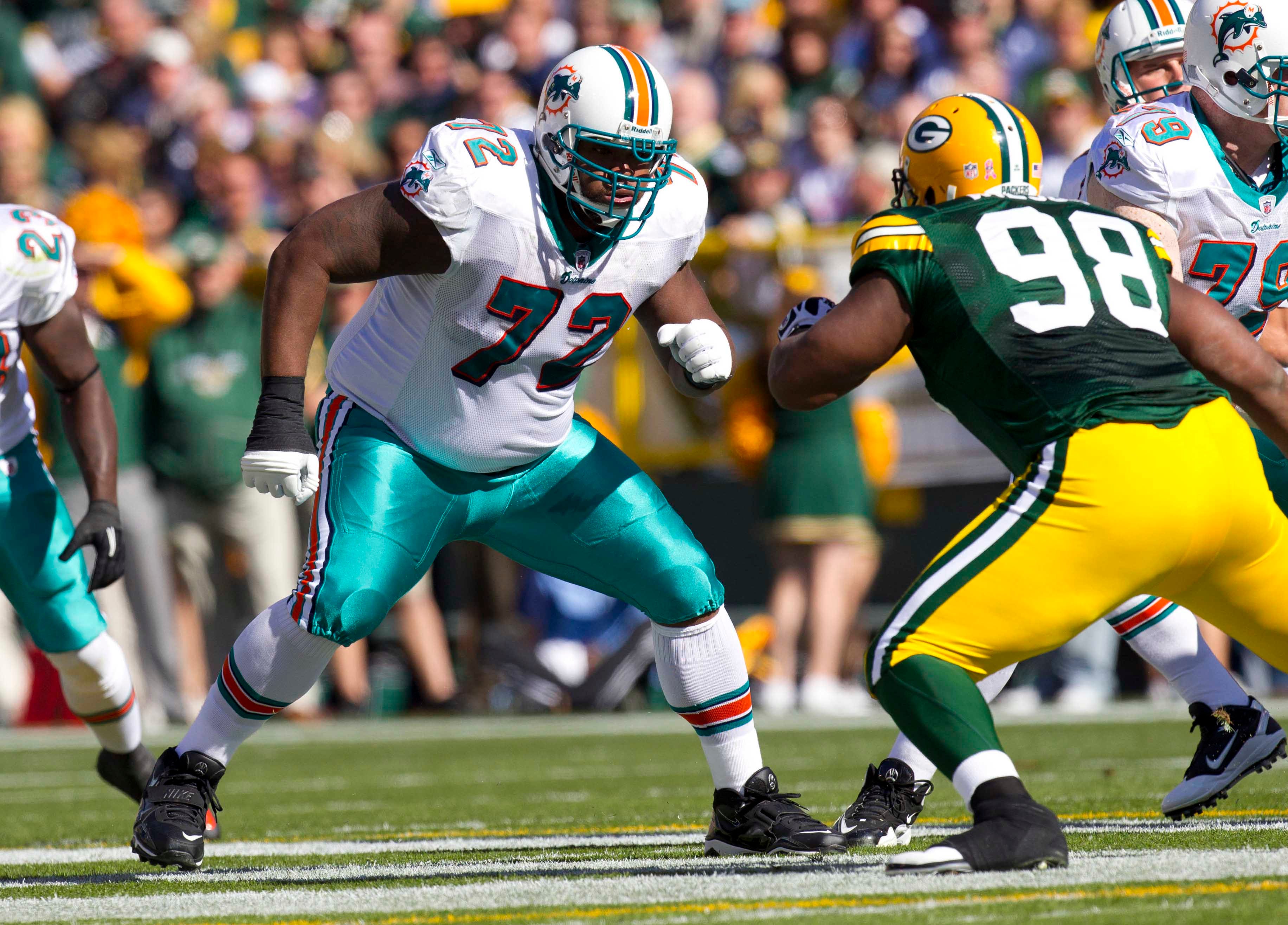 Miami Dolphins tackle Vernon Carey blocks during the game against the Green Bay Packers at Lambeau Field.