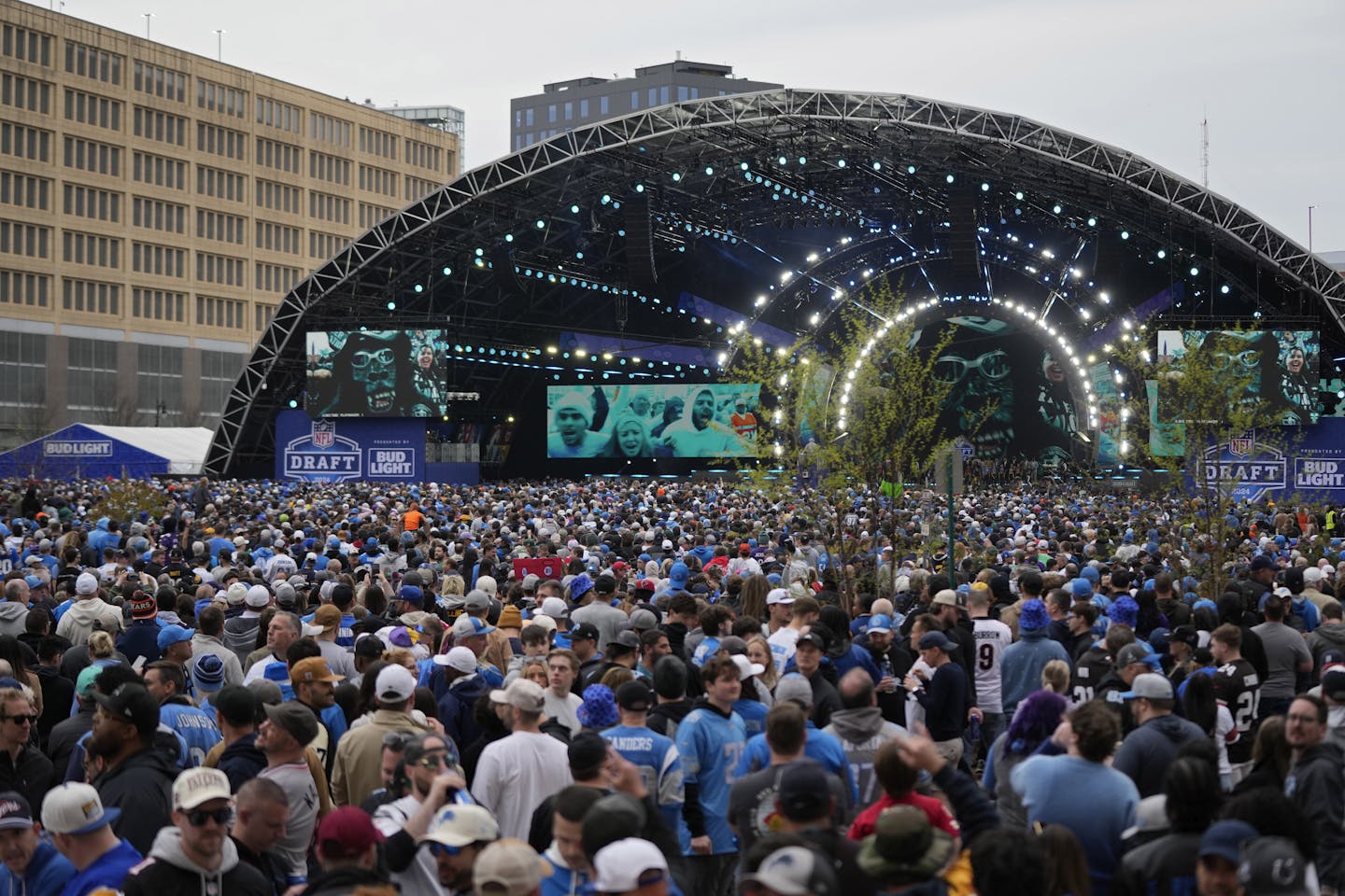 An overhead shot of a crowd filling an outdoor stage.