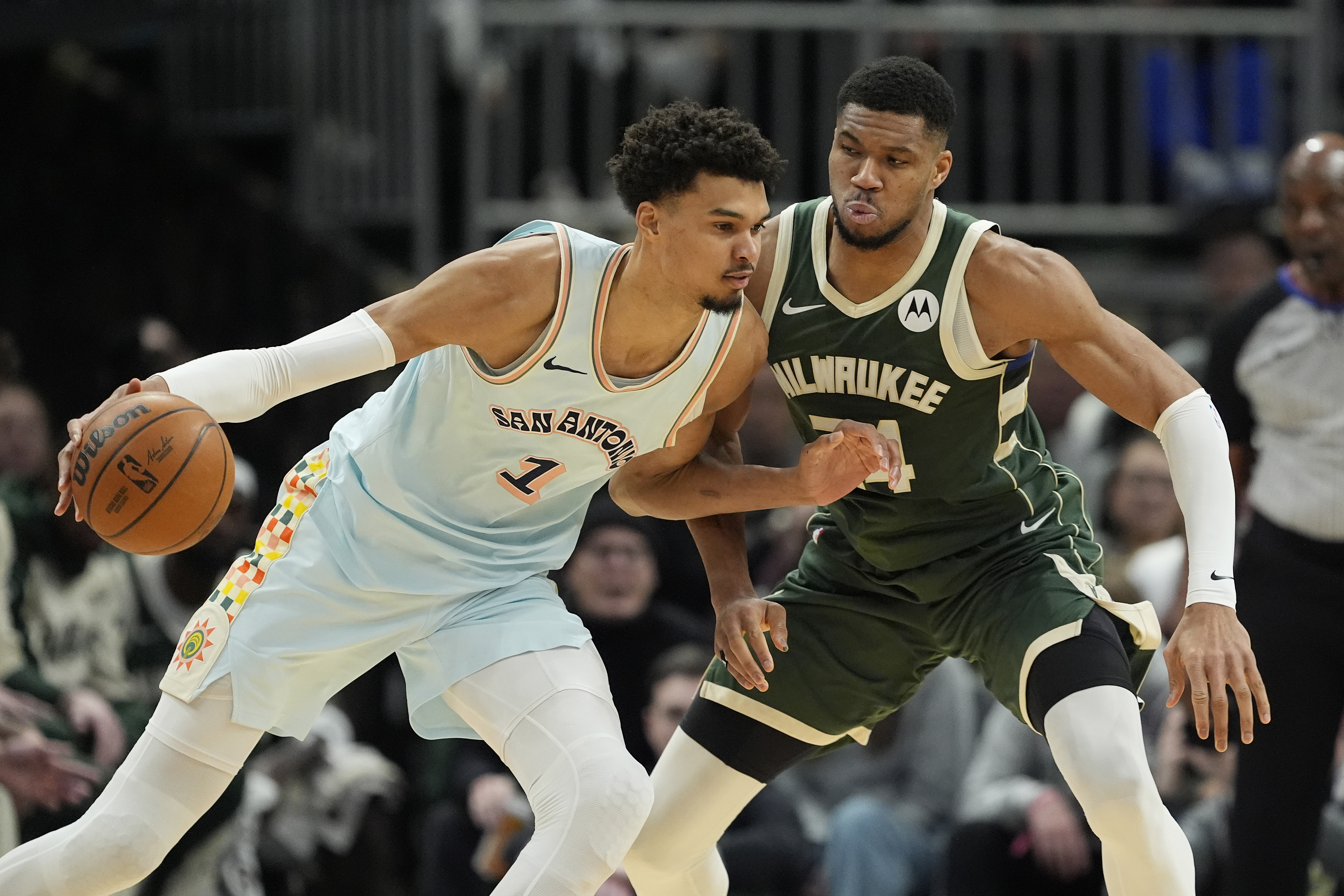MILWAUKEE, WISCONSIN - JANUARY 08: Giannis Antetokounmpo #34 of the Milwaukee Bucks defends Victor Wembanyama #1 of the San Antonio Spurs during the second quarter at Fiserv Forum on January 08, 2025 in Milwaukee, Wisconsin. NOTE TO USER: User expressly acknowledges and agrees that, by downloading and or using this photograph, User is consenting to the terms and conditions of the Getty Images License Agreement. (Photo by Patrick McDermott/Getty Images)