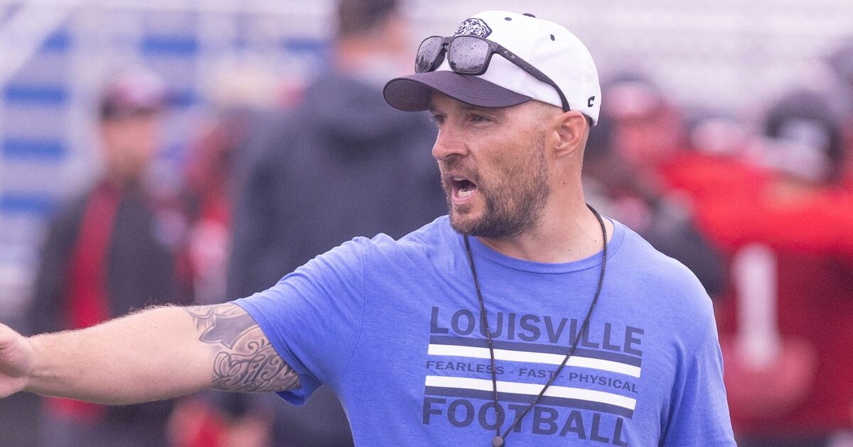 Louisville head varsity football coach Chris Kappas works with his team during a scrimmage against Orrville at Louisville Friday, August 9, 2024.