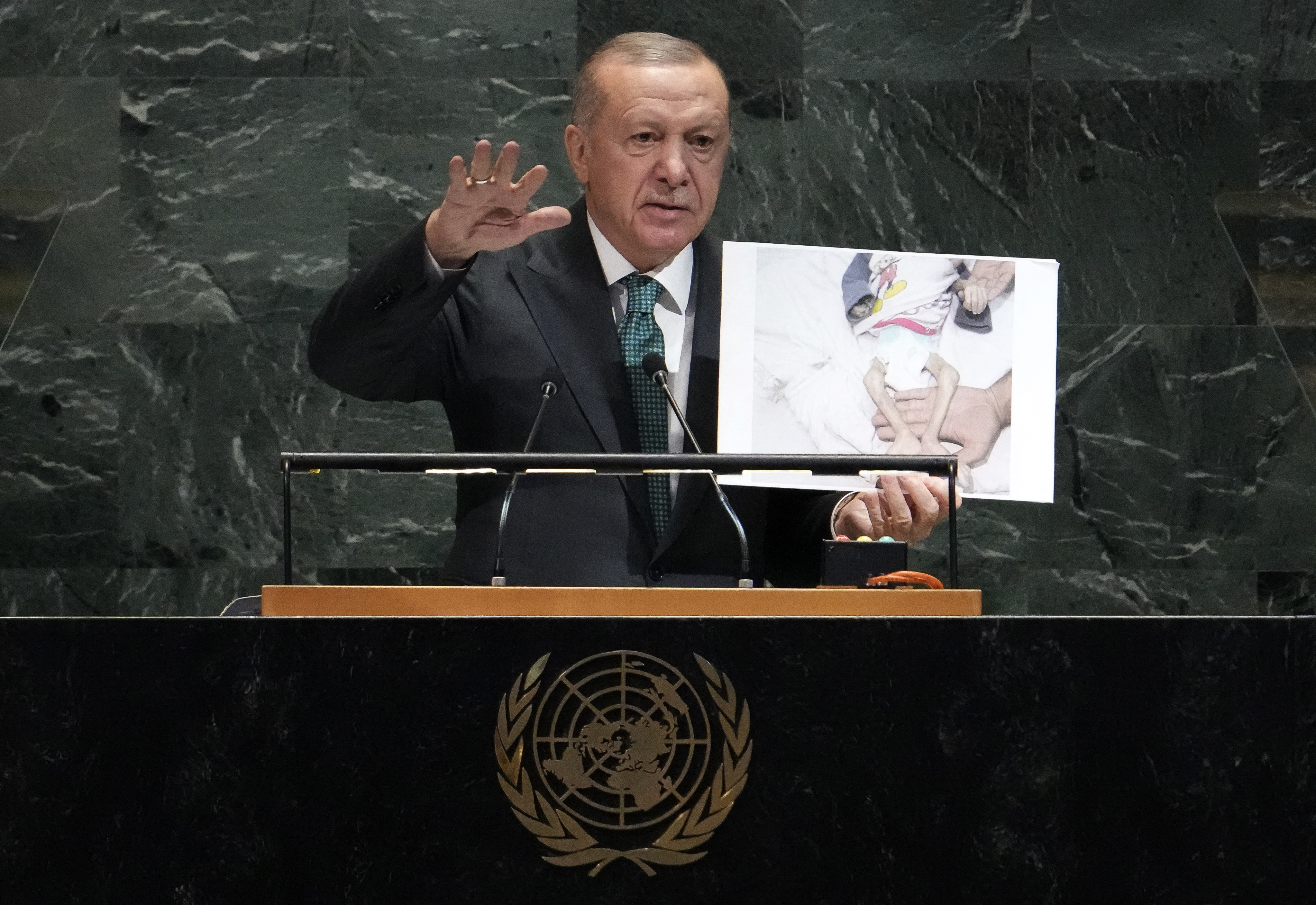 EDITORS NOTE: Graphic content / Turkey's President Recep Tayyip Erdogan holds up a photo from Gaza as he speaks during the General Debate of the United Nations General Assembly at the UN headquarters in New York City on September 23, 2025. (Photo by TIMOTHY A. CLARY / AFP)