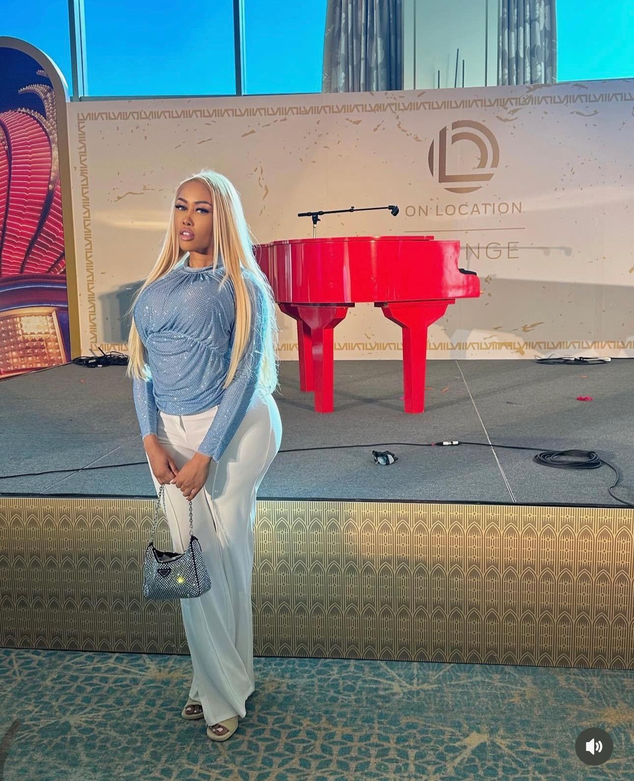 Moriah Mills holding a purse