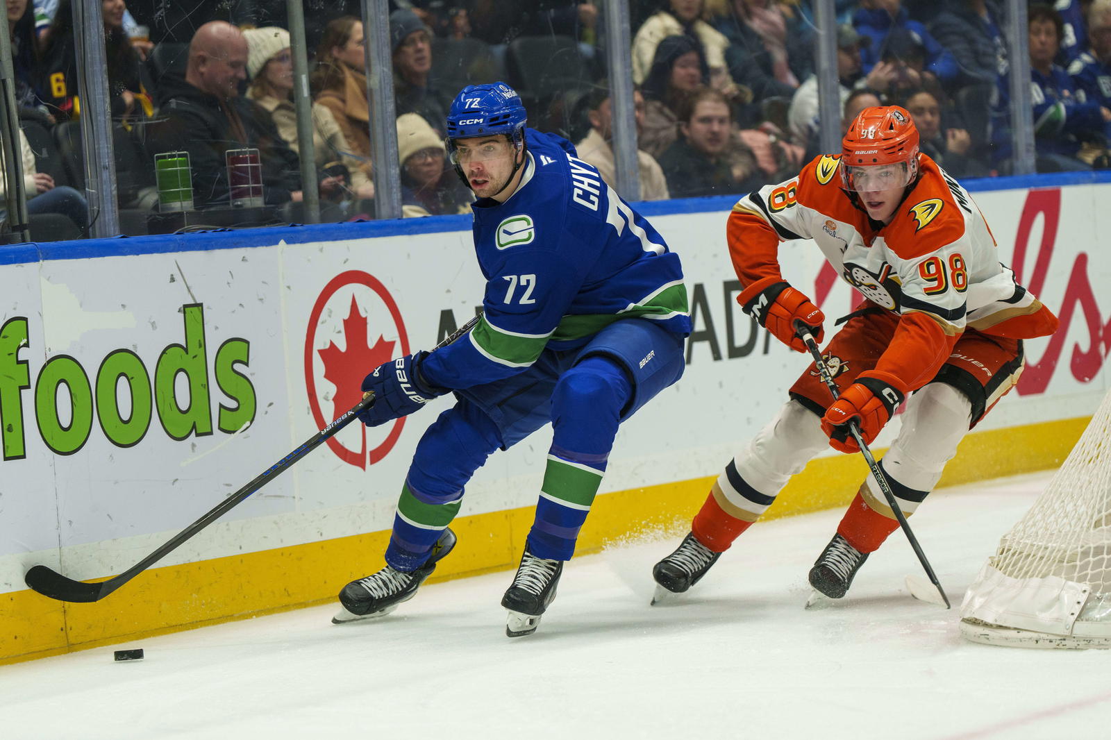 Jan 29, 2026; Vancouver, British Columbia, CAN; Vancouver Canucks center Filip Chytil (72) is pursued by Anaheim Ducks Defenseman Pavel Mintyukov (98) during the first period at Rogers Arena. Mandatory Credit: Christopher Morris-Imagn Images