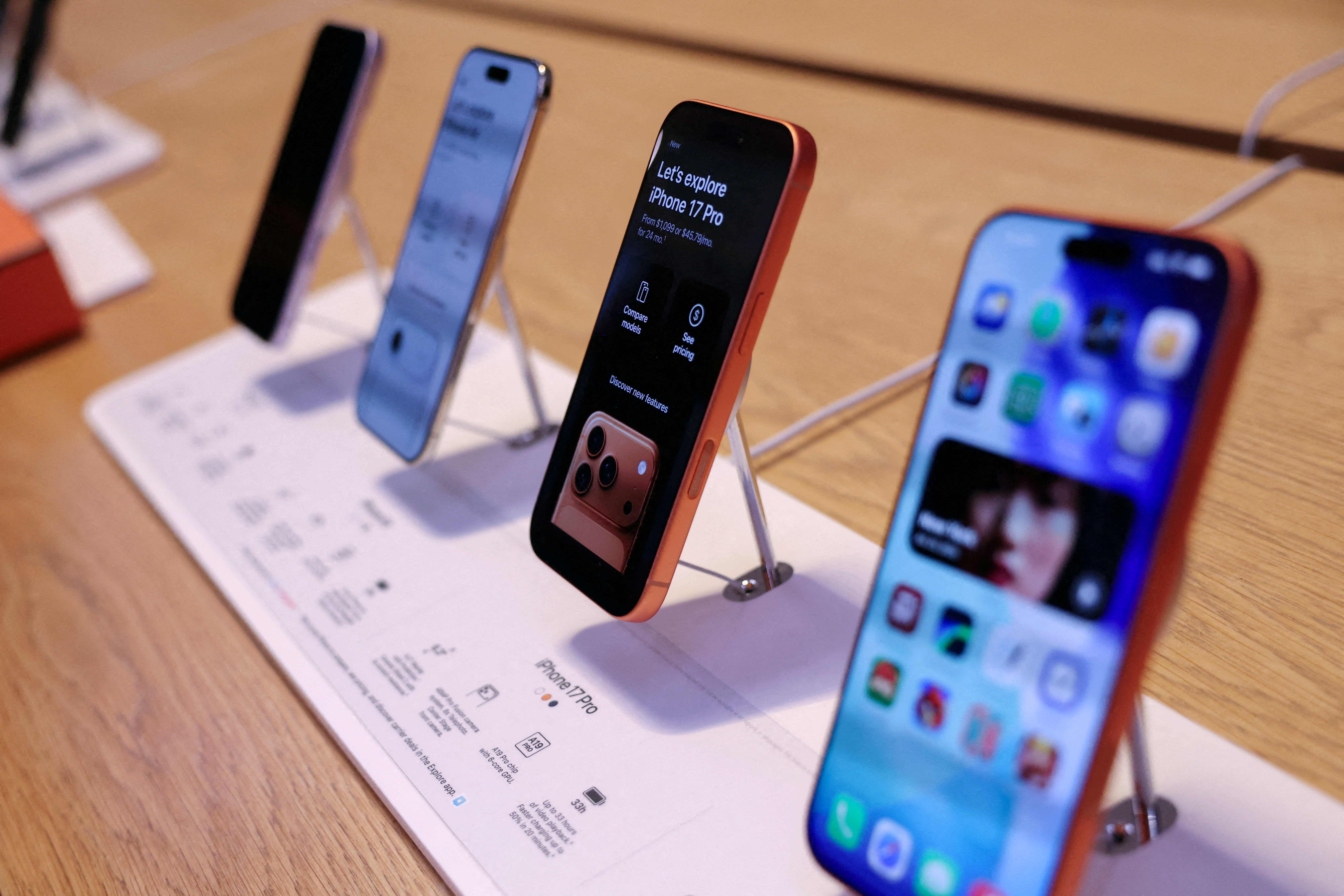 FILE PHOTO: The iPhone 17 series stands on display at the Apple Store in New York City, U.S., September 19, 2025. REUTERS/Shannon Stapleton/File Photo