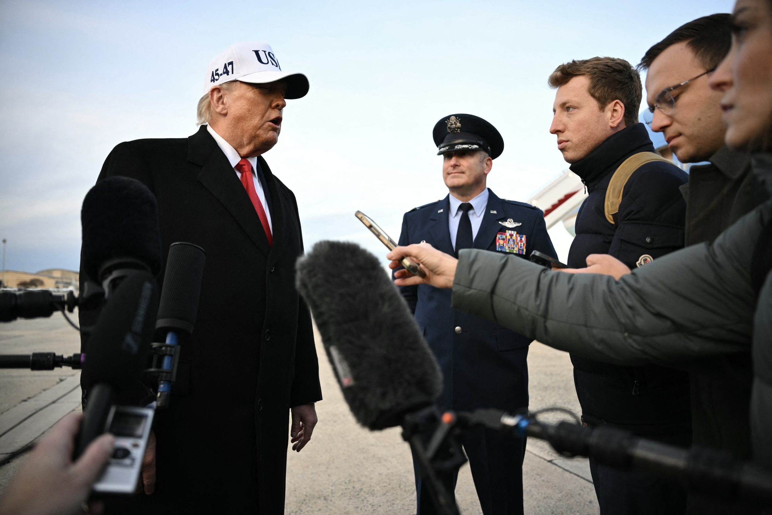 US President Donald Trump speaks to the press upon returning to Joint Base Andrews in Maryland on January 13, 2026. Photo by Mandel NGAN / AFP via Getty Images