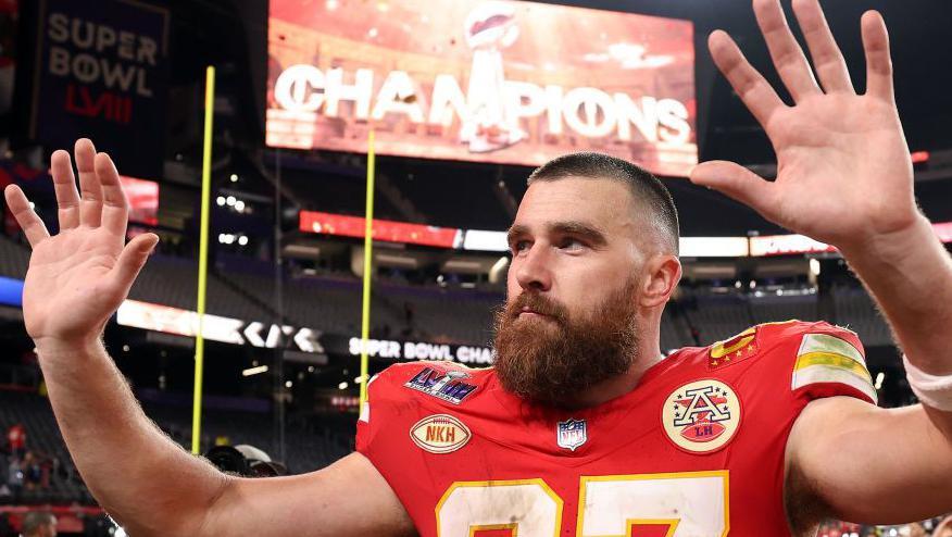 Travis Kelce waves to fans after the Kansas City Chiefs beat the San Francisco 49ers in the Super Bowl in 2024