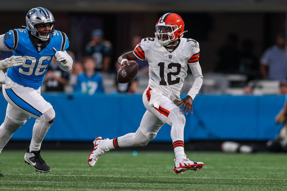 CHARLOTTE, NORTH CAROLINA - AUGUST 08: Shedeur Sanders #12 of the Cleveland Browns escapes a tackle from Jaden Crumedy #96 of the Carolina Panthers during the first half of an NFL Preseason 2025 game at Bank of America Stadium on August 08, 2025 in Charlotte, North Carolina. (Photo by David Jensen/Getty Images)