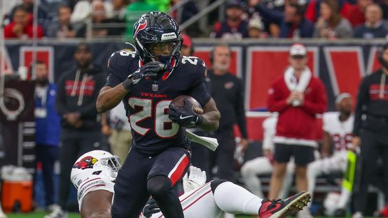 Dec 14, 2025; Houston, Texas, USA; Houston Texans running back Jawhar Jordan (26) breaks the tackle of Arizona Cardinals defensive tackle Dalvin Tomlinson (94) in the first quarter at NRG Stadium.