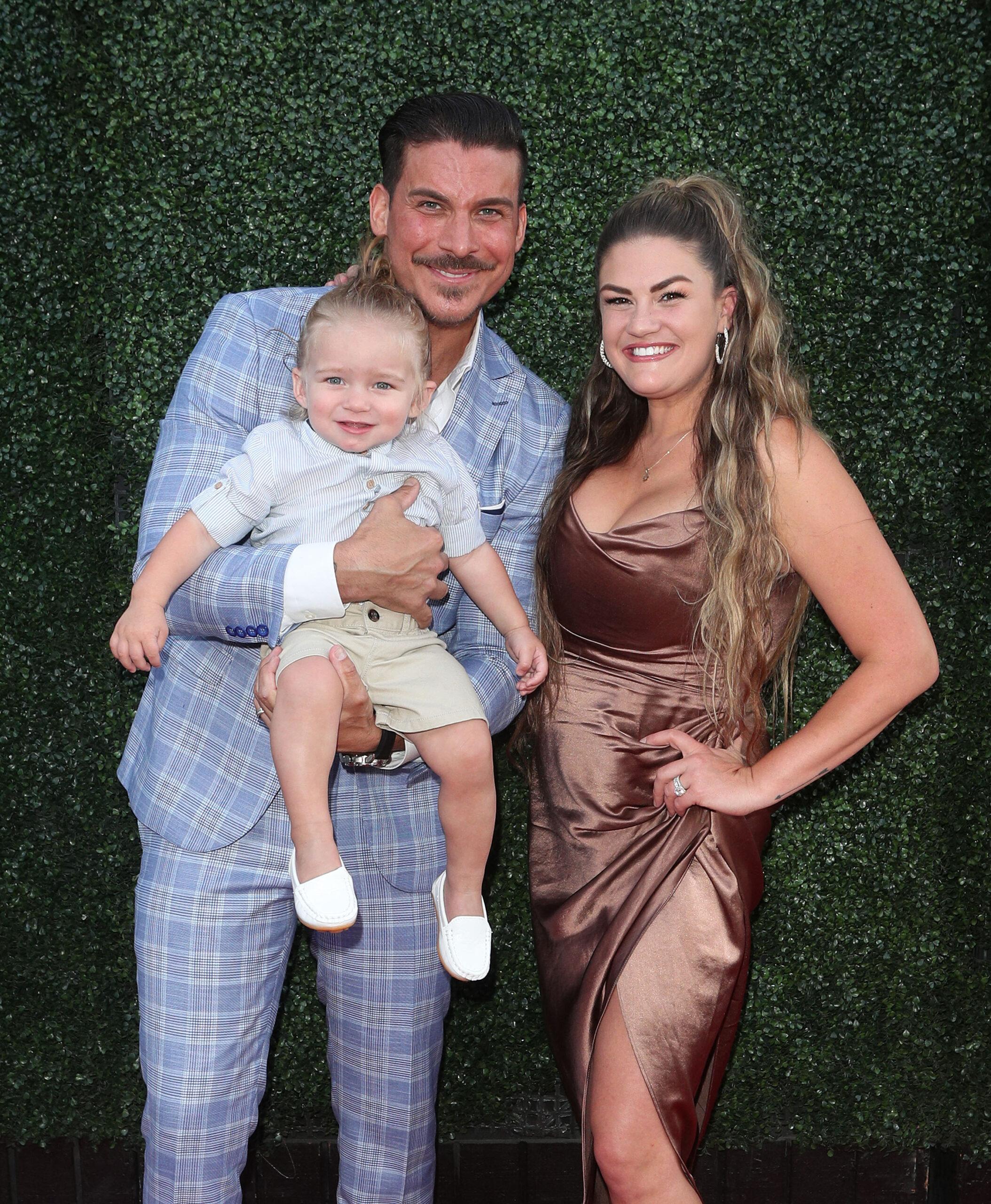 Brittany Cartwright, Jax Taylor, and son Cruz on the red carpet.