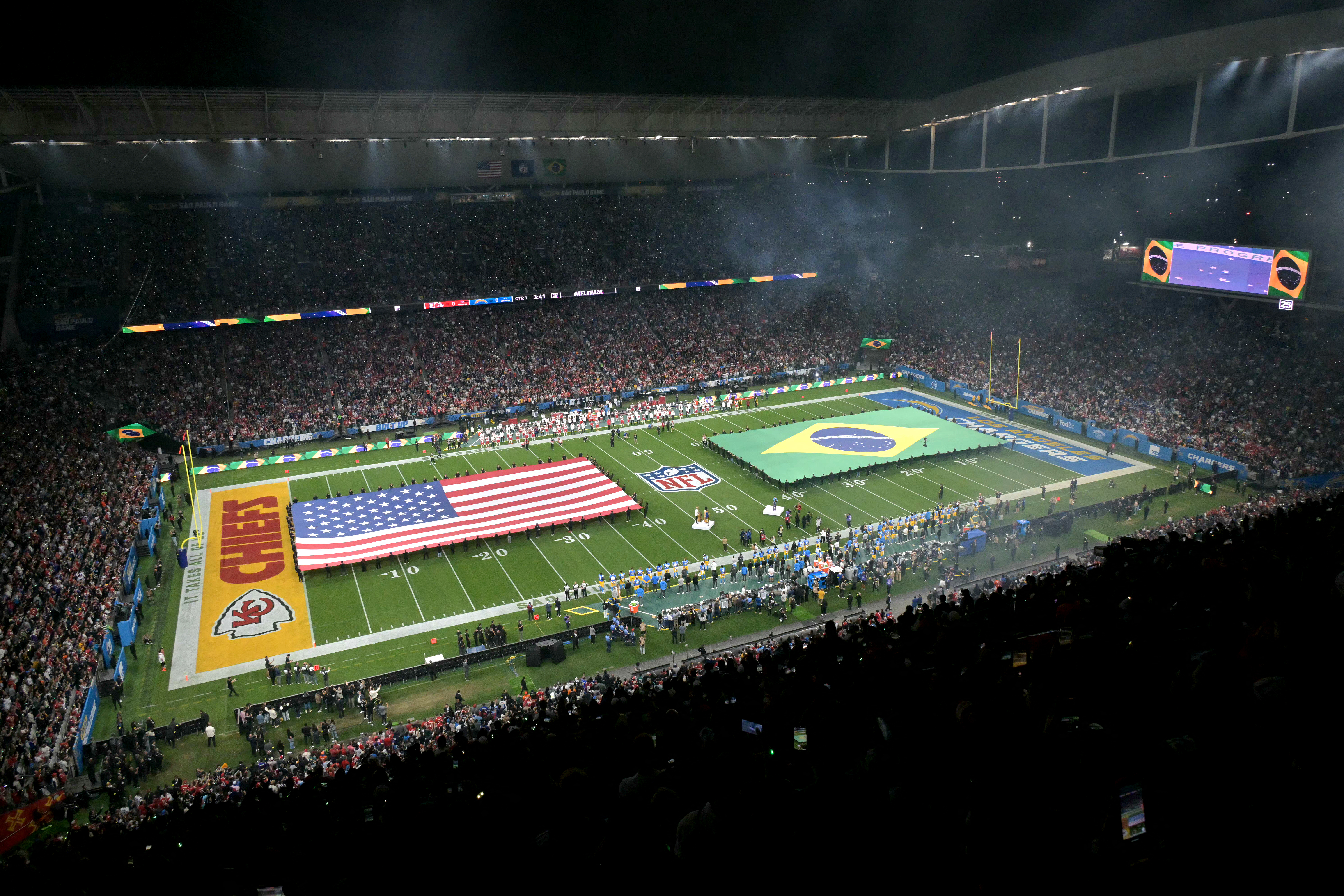Giant flags of the US and Brazil are displayed on the pitch ahead of the NFL game between the Kansas City Chiefs and Los Angeles Chargers at the Neo Quimica Arena Stadium in Sao Paulo, Brazil, on September 5, 2025. (Photo by NELSON ALMEIDA / AFP) (Photo by NELSON ALMEIDA/AFP via Getty Images)