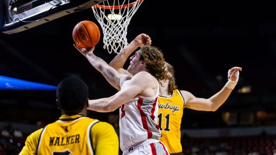 UNLV Runnin&rsquo; Rebels forward Walter Brown (22) goes for a contested lay-up during the first round of a Mountain West Championship tournament game between the UNLV Runnin&rsquo; Rebels and the Wyoming Cowboys, Wednesday March 11, 2026 in Las Vegas, Nev.