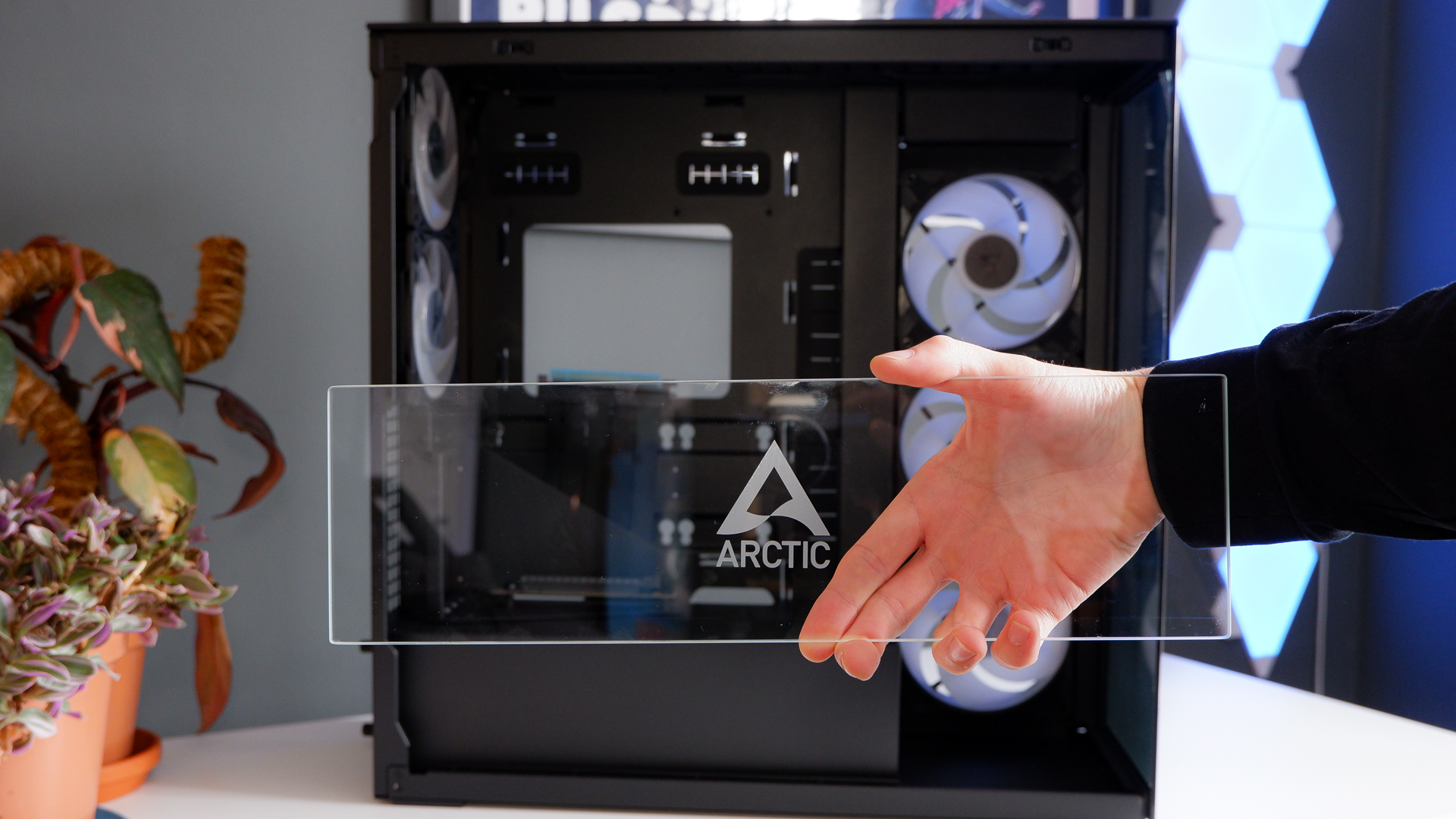 Arctic's Xtender PC case on a white desk with various parts being installed to build a functional gaming PC.