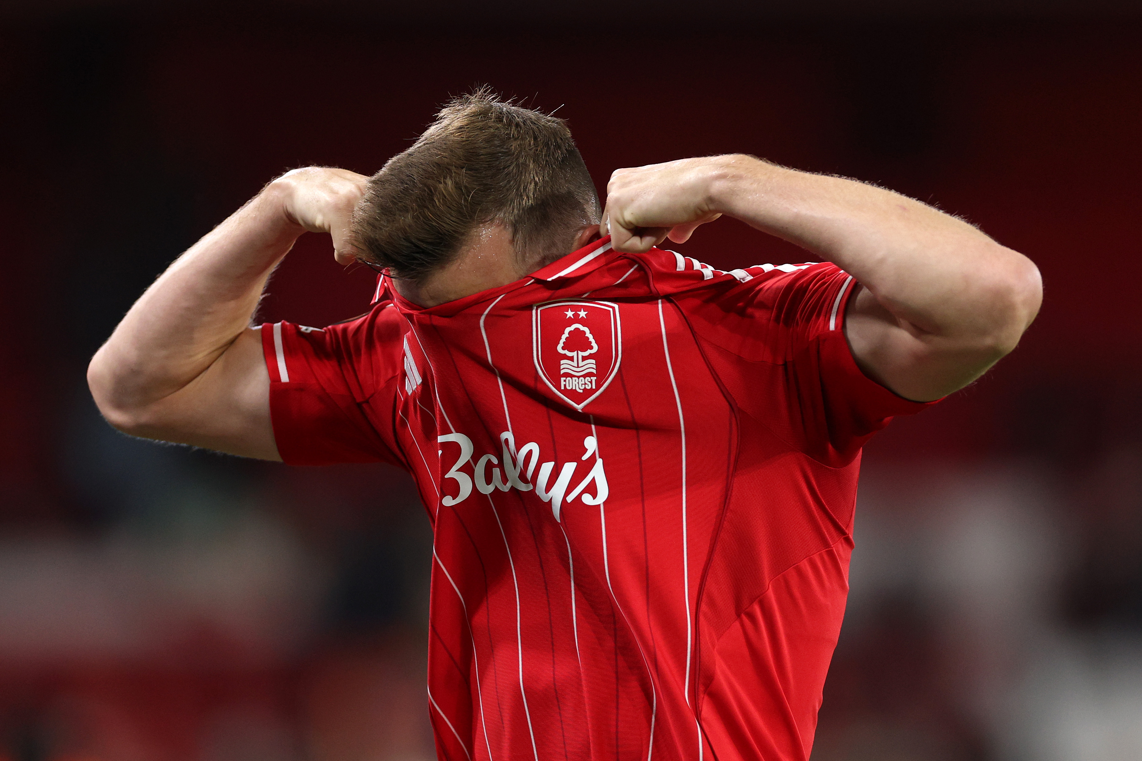 Nottingham Forest striker Chris Wood pulls his shirt up in frustration