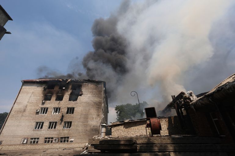 Rescue workers put out a fire of a building destroyed by a Russian drone strike in Zaporizhzhia, Ukraine, on Monday, July 7, 2025. (AP Photo/Kateryna Klochko)