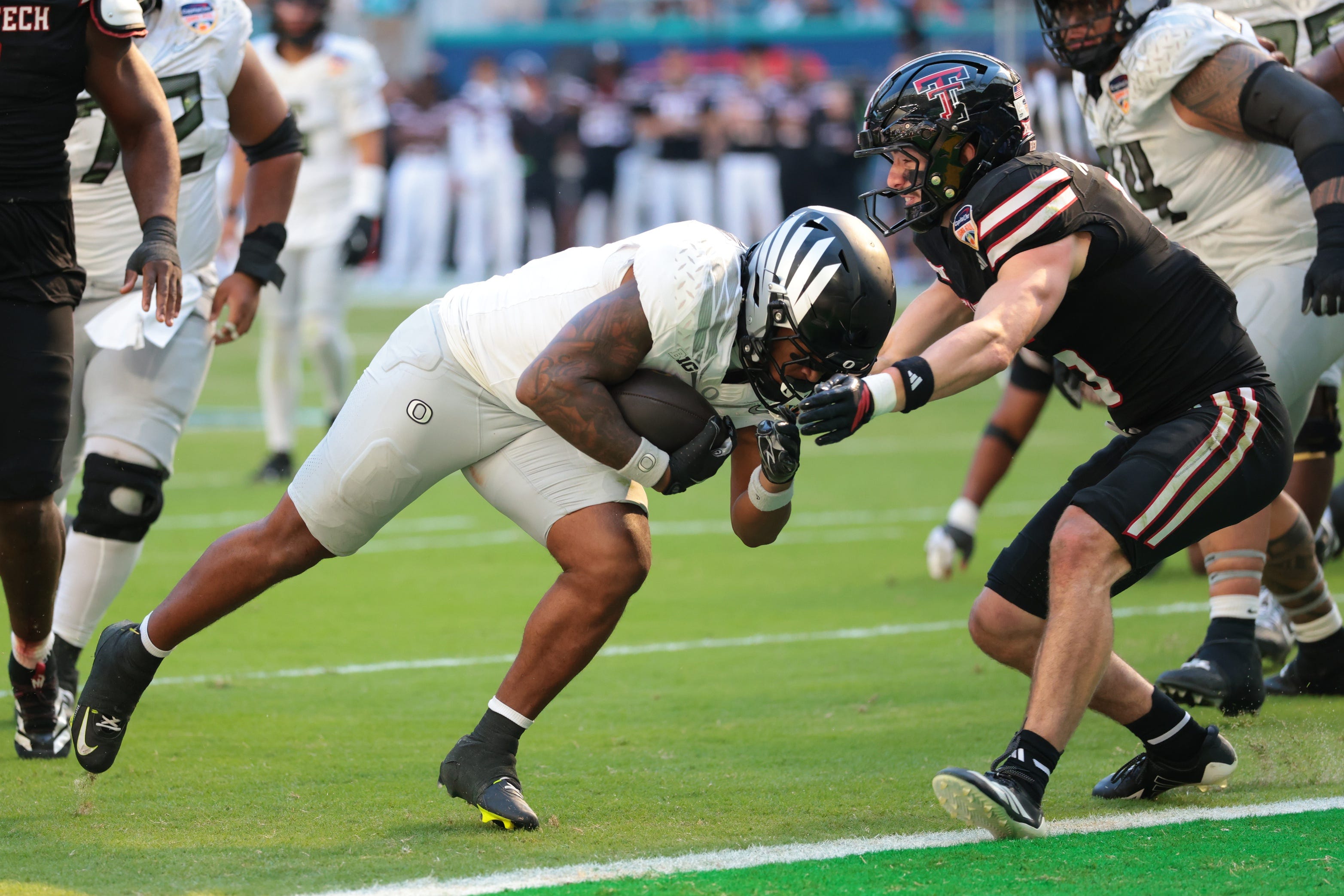 Jan 1, 2026; Miami Gardens, FL, USA; Oregon Ducks running back Jordon Davison (0) carries the ball for a touchdown against the Texas Tech Red Raiders during the second half of the 2025 Orange Bowl and quarterfinal game of the College Football Playoff at Hard Rock Stadium. Mandatory Credit: Sam Navarro-Imagn Images
