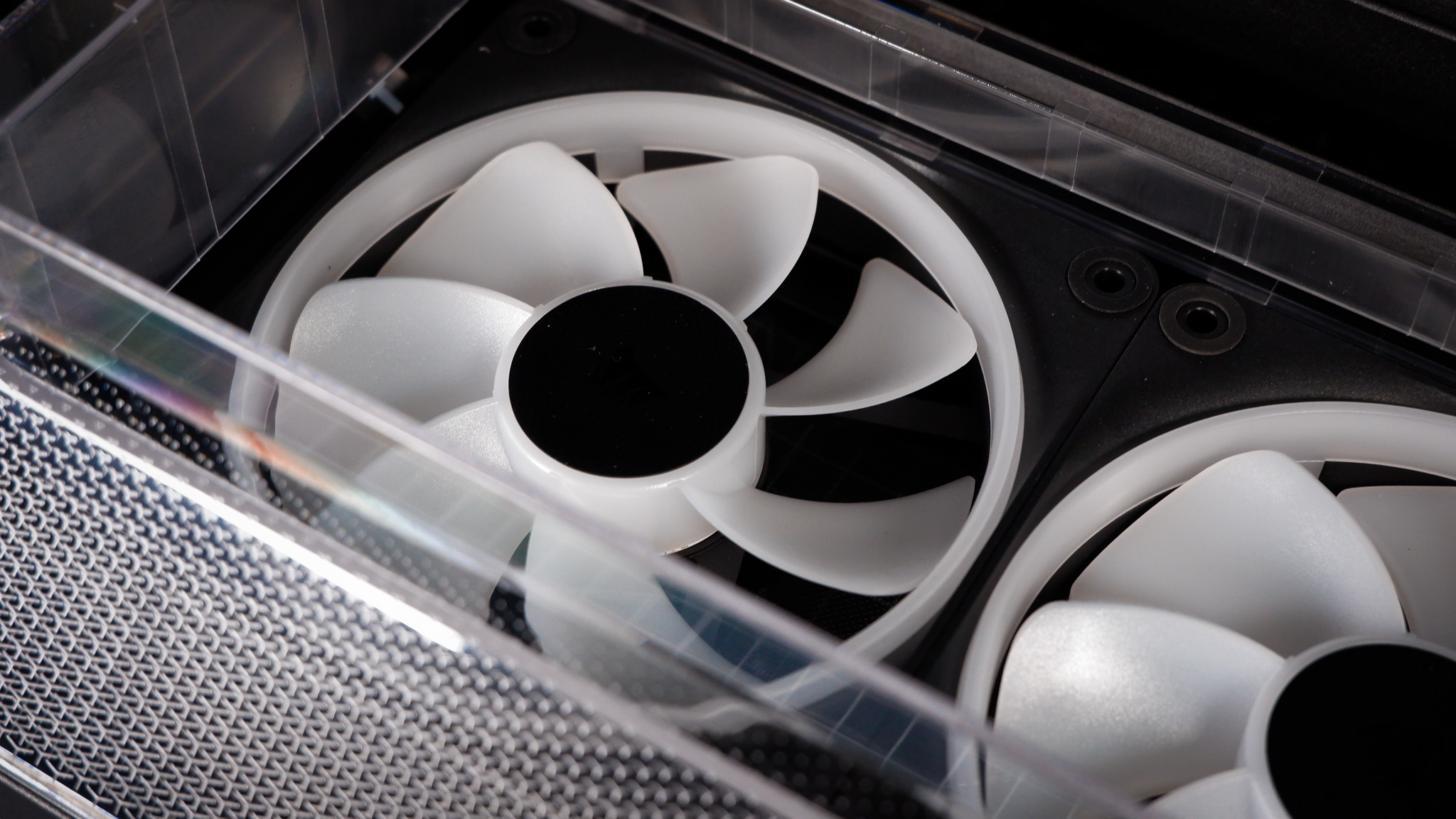 A Corsair Air 5400 PC case on a desk with various parts installed.