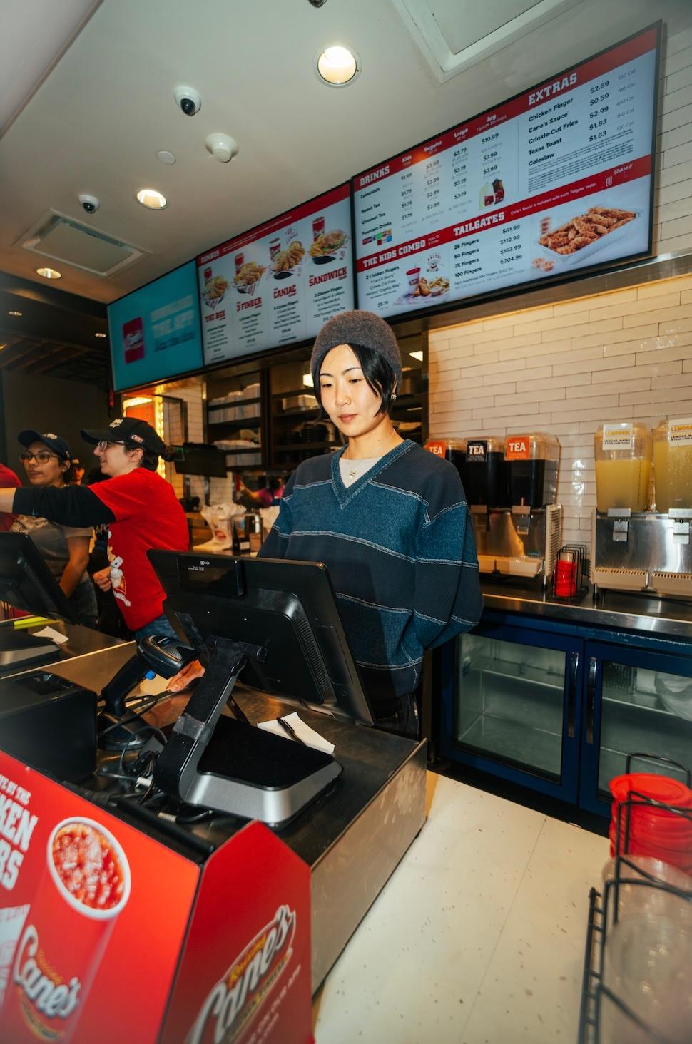 May Hong during a surprise &ldquo;shift&rdquo; at Raising Cane&rsquo;s Times Square Global Flagship