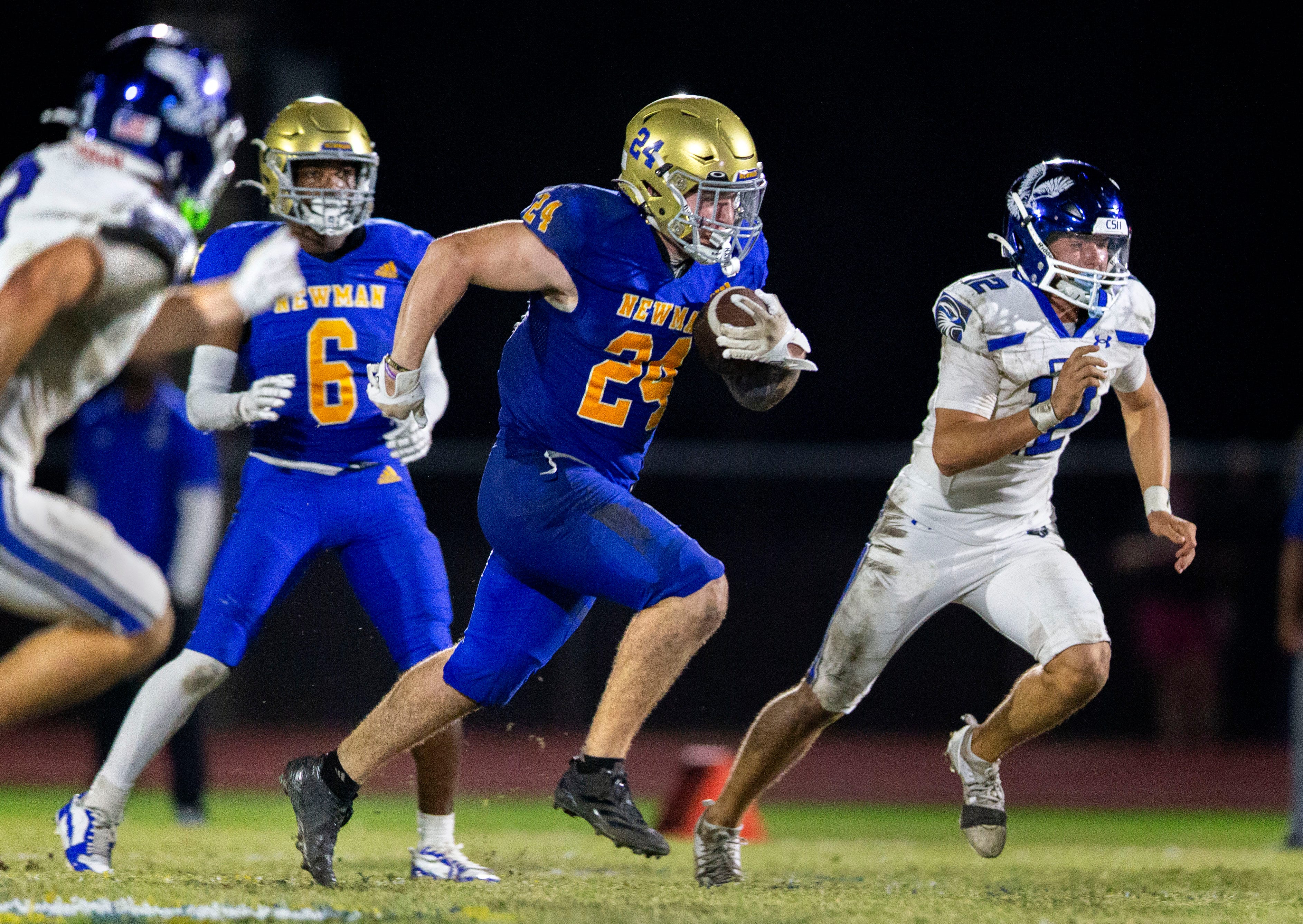 Cardinal Newman running back Phoenix Donghia runs the ball against Community School of Naples during their playoff game on November 21, 2025, in West Palm Beach, Florida.