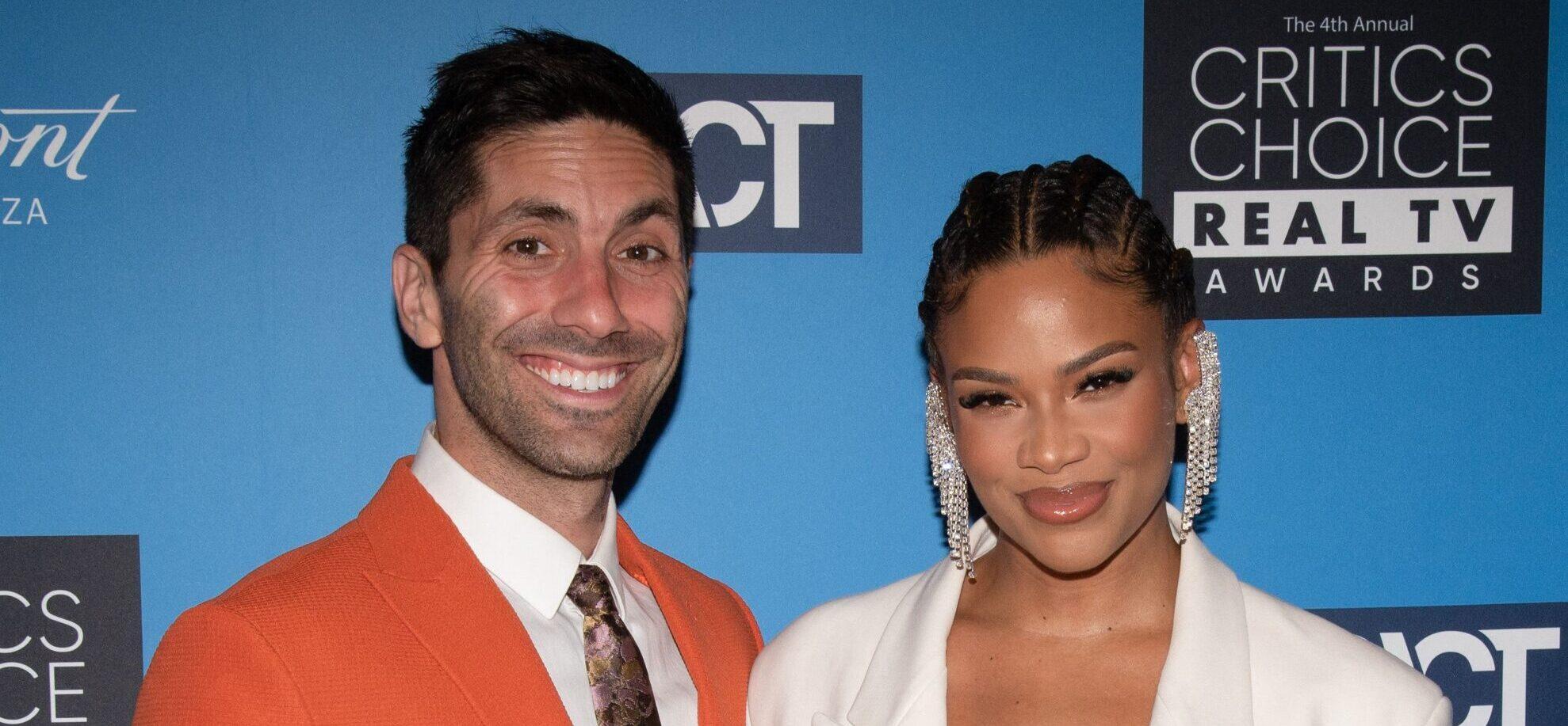 Nev Schulman and Kamie Crawford posing on the red carpet.