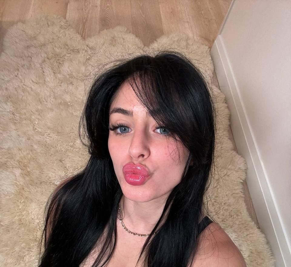 Camilla Araujo kneeling on floor