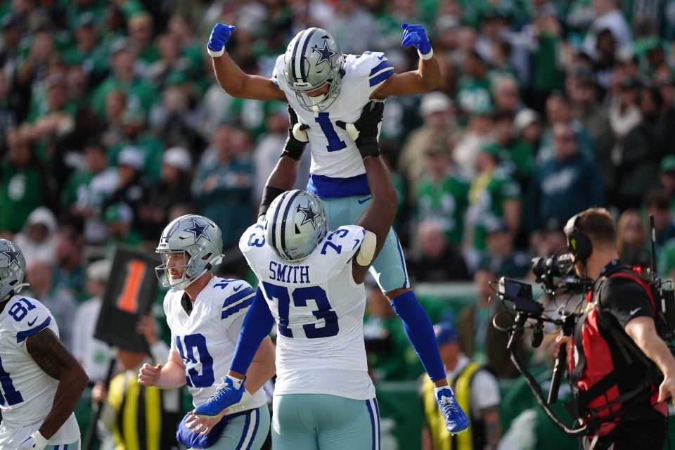 PHILADELPHIA, PA - DECEMBER 29: Dallas Cowboys wide receiver Jalen Tolbert (1) celebrates with offensive lineman Tyler Smith (73) after a touchdown in the first half during the game between the Dallas Cowboys and Philadelphia Eagles on December 29, 2024 at Lincoln Financial Field in Philadelphia, PA. (Photo by Kyle Ross/Icon Sportswire via Getty Images)