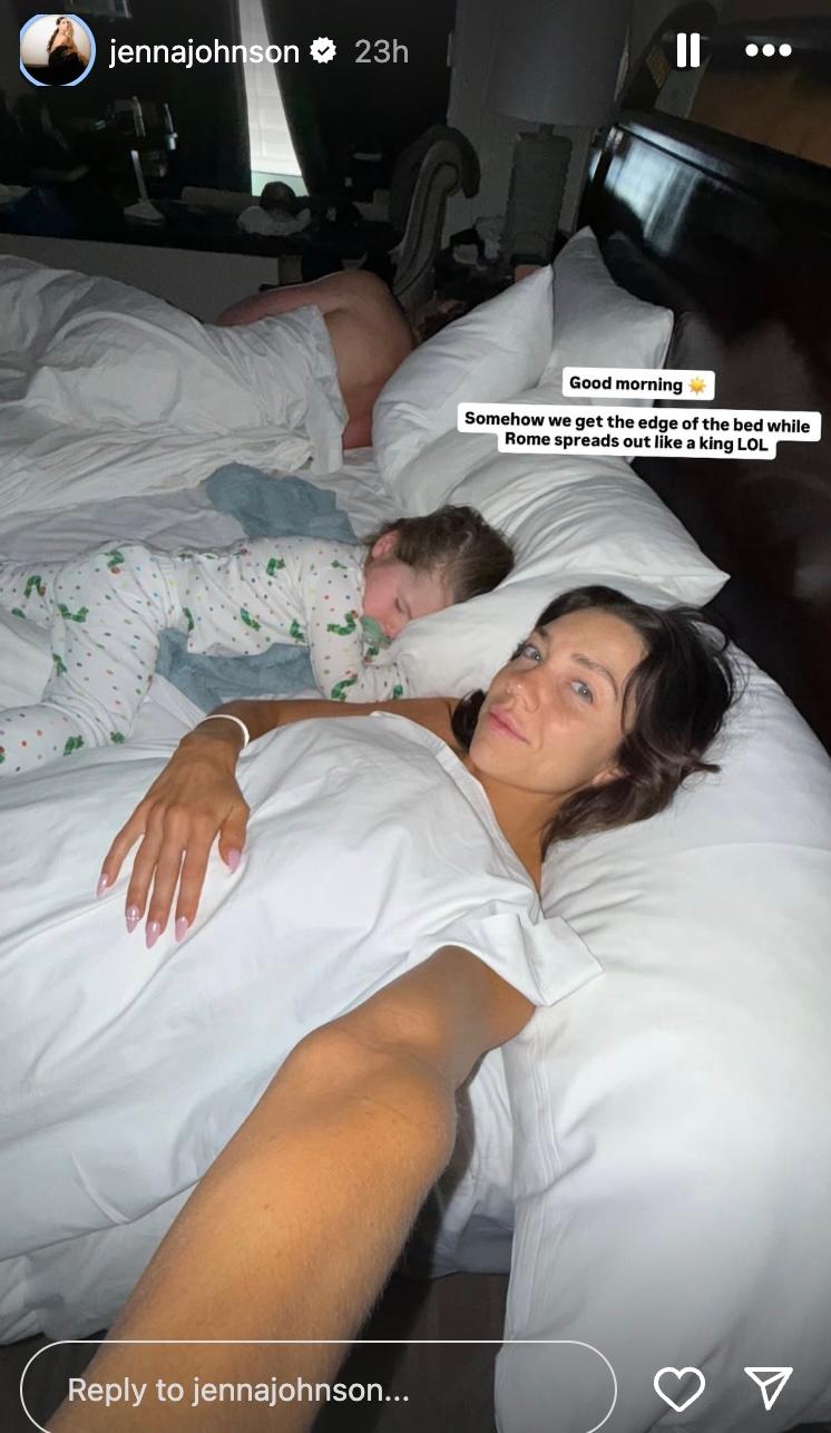 Jenna Johnson laying in bed with her son