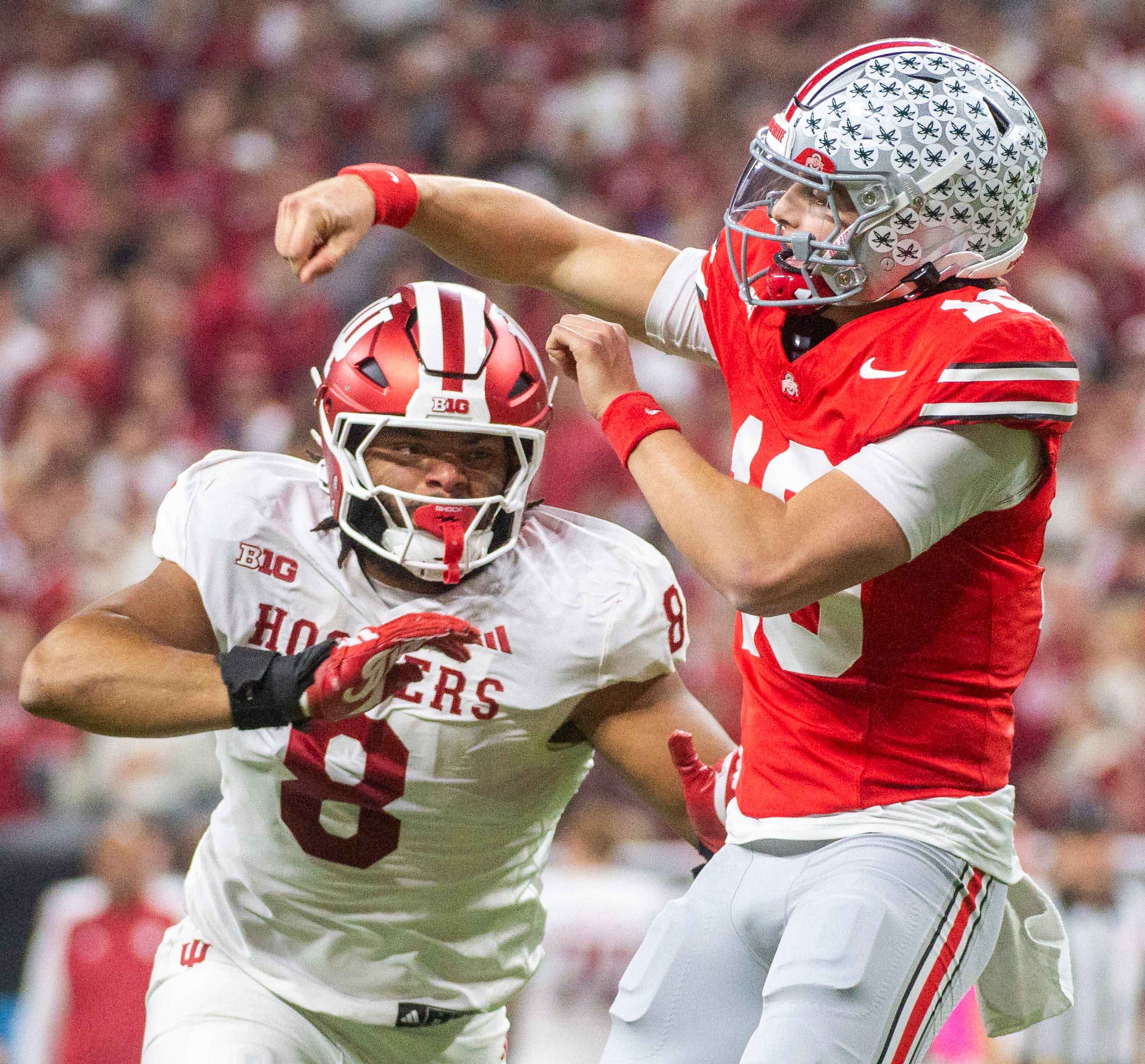 Indiana's Stephen Daley (8) pressures Ohio State's Julian Sayin (10) during the BIg Ten Championship football game at Lucas Oil Stadium on Saturday, Dec. 6, 2025.